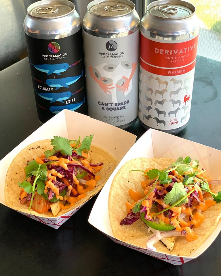 Two tacos from Mings Food Truck with three beers next to them.