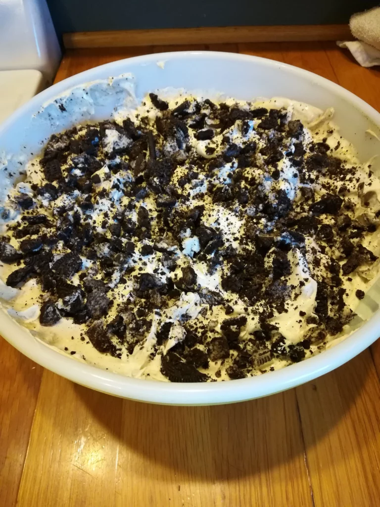 A large bowl of Oreo Fluff on a counter top.