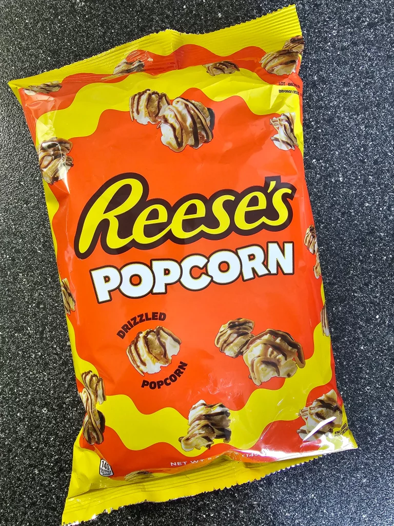 Front package of Reese's Puffs Cereal Popcorn.