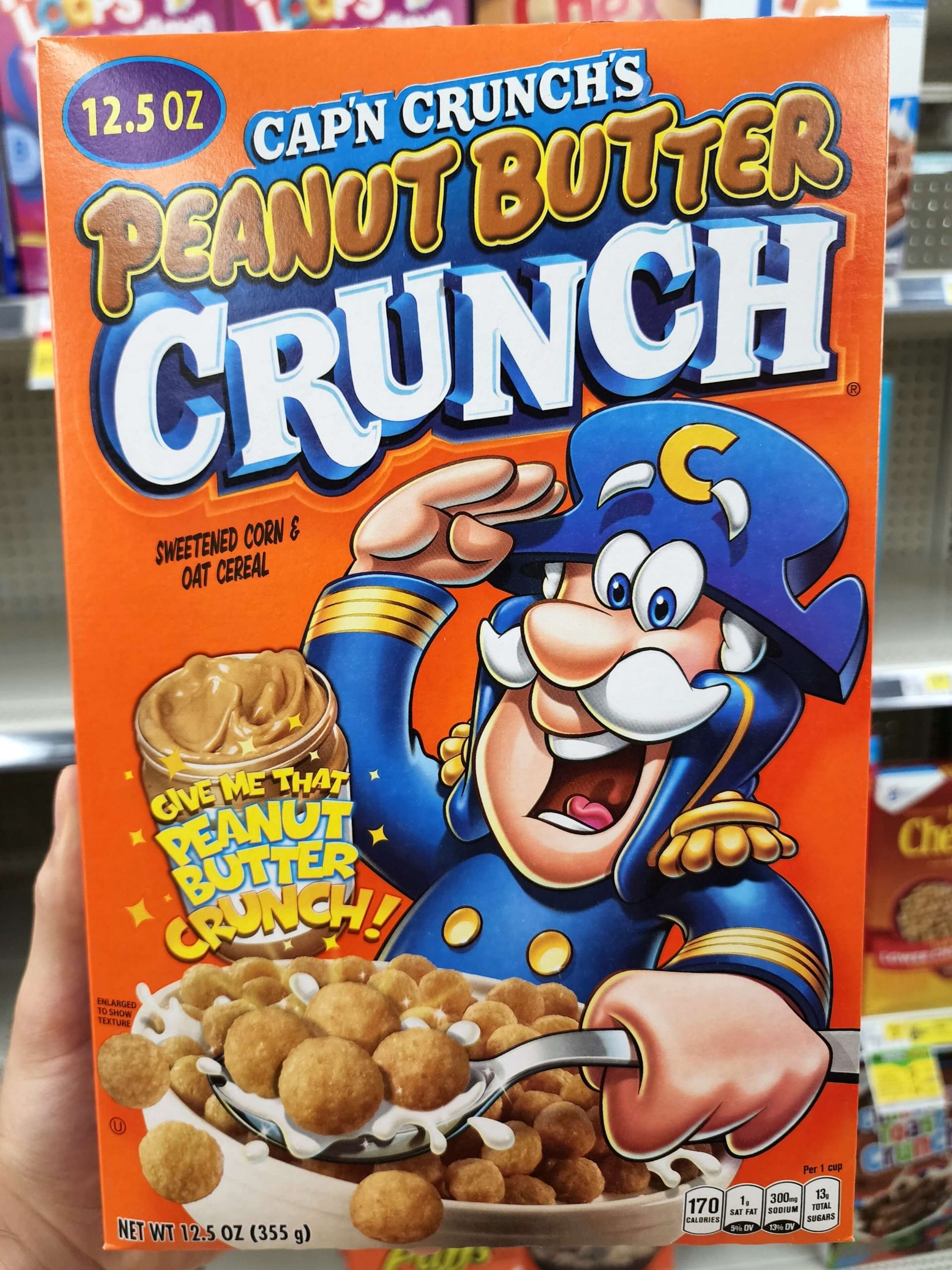Front of Cap'n Crunch's Peanut Butter Crunch cereal box.