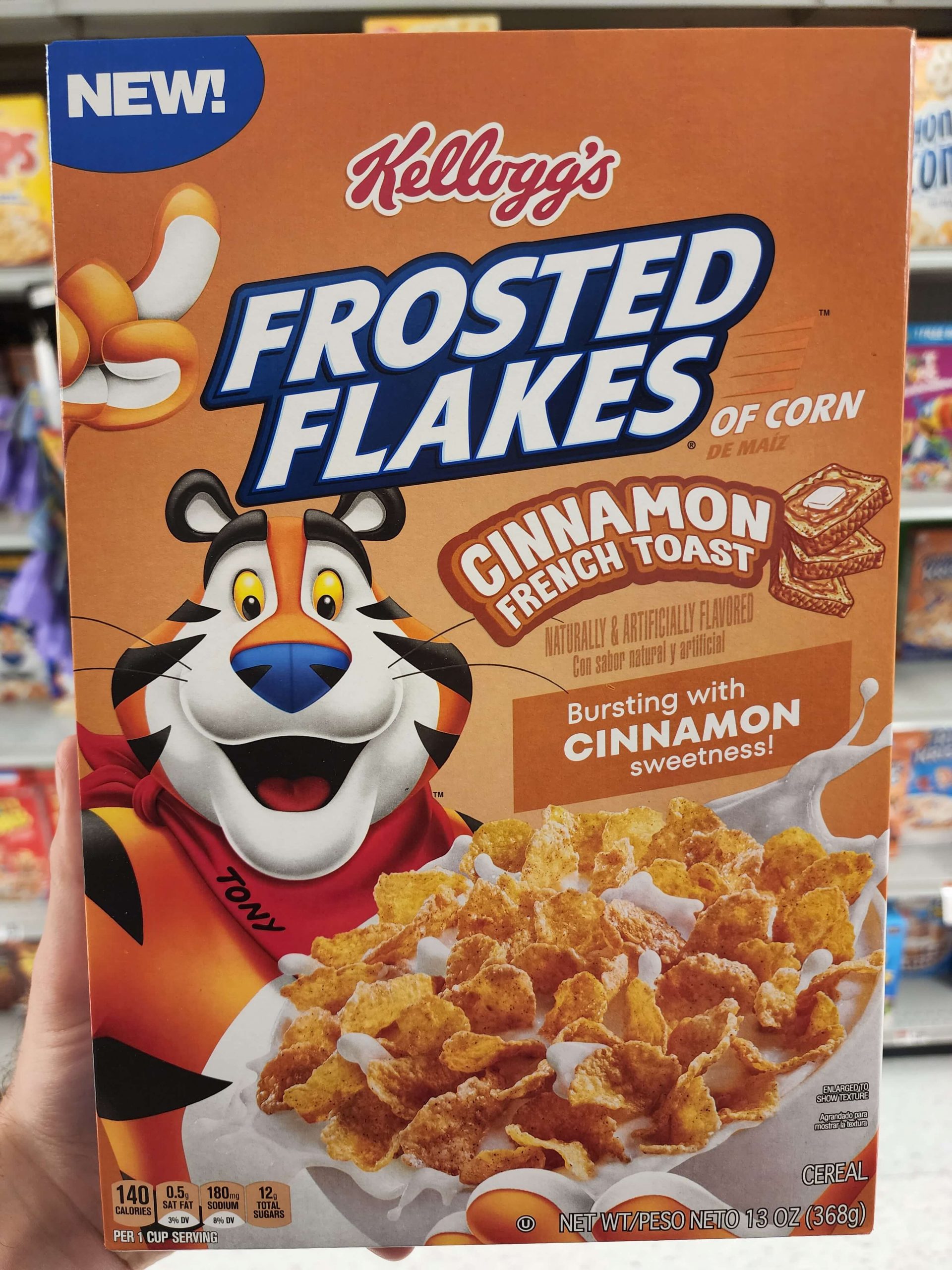 Front of Kellogg's Frosted Flakes Cinnamon French Toast cereal box.