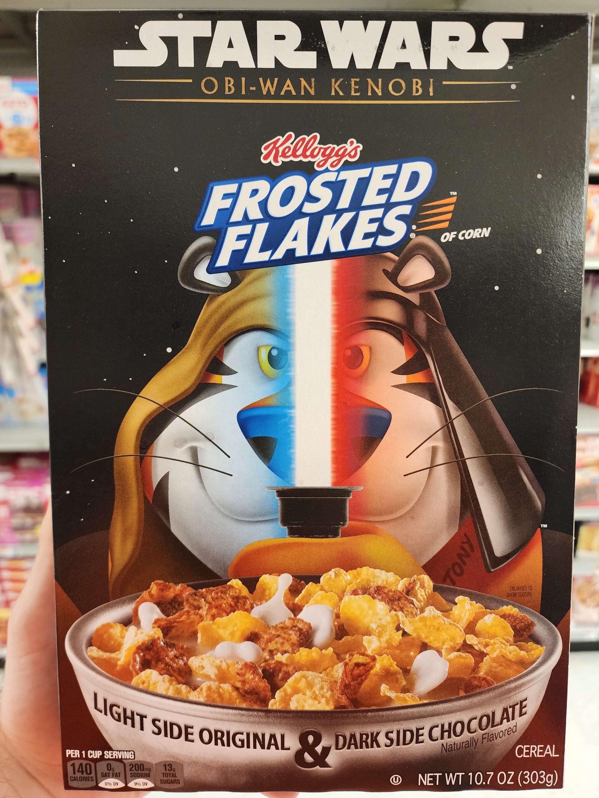 Front of Kellogg's Star Wars Obi-Wan Kenobi Frosted Flakes cereal box. Mix of light side and dark side chocolate flakes.