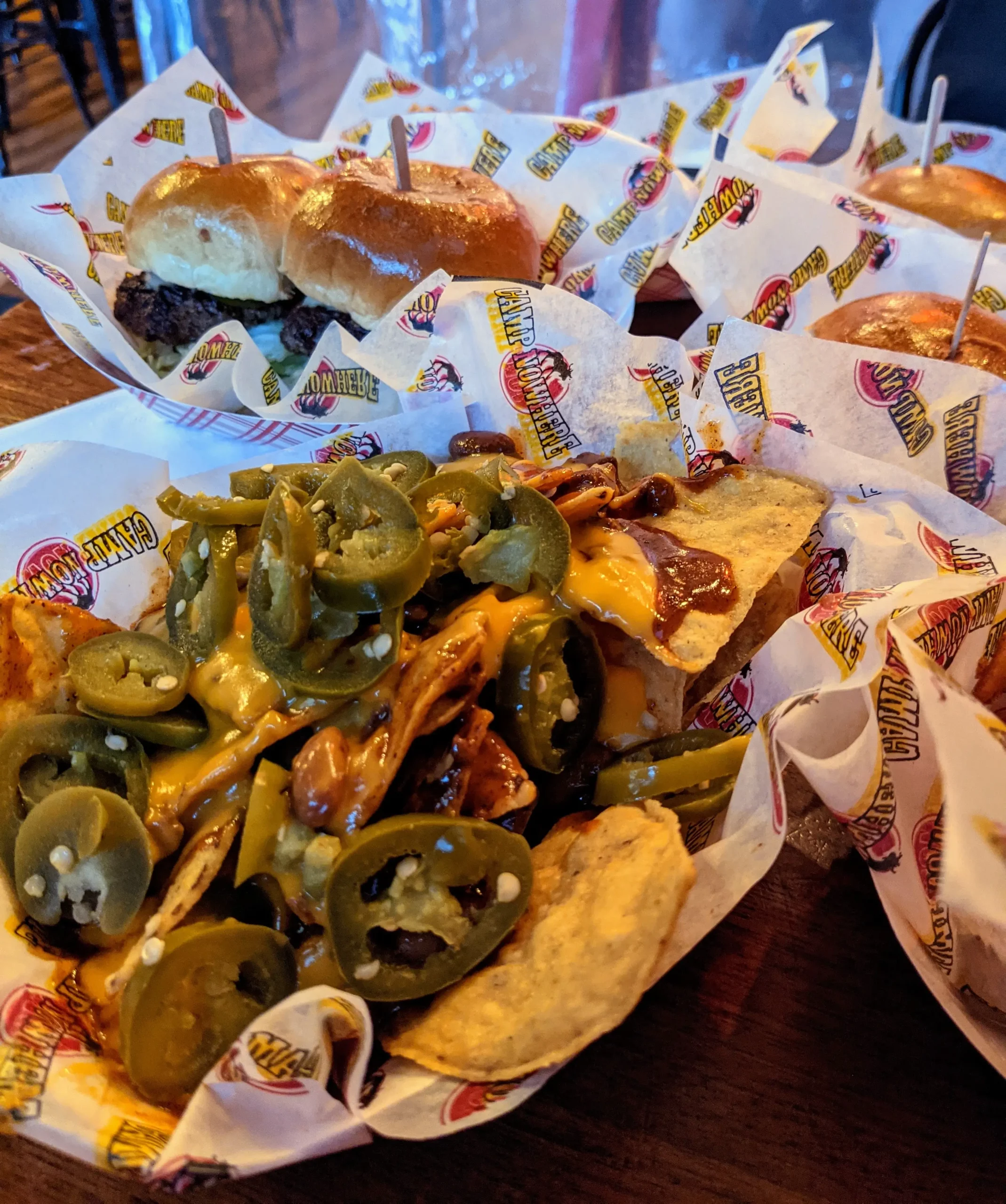 Camp Nowhere loaded nachos on a table.