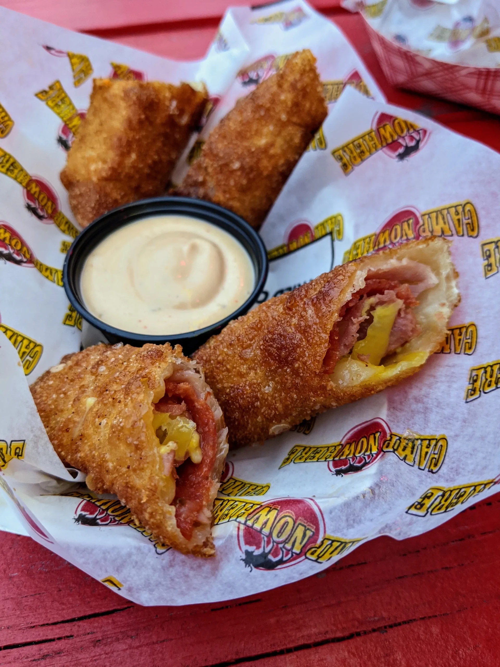 Camp Nowhere meat egg rolls on a table.