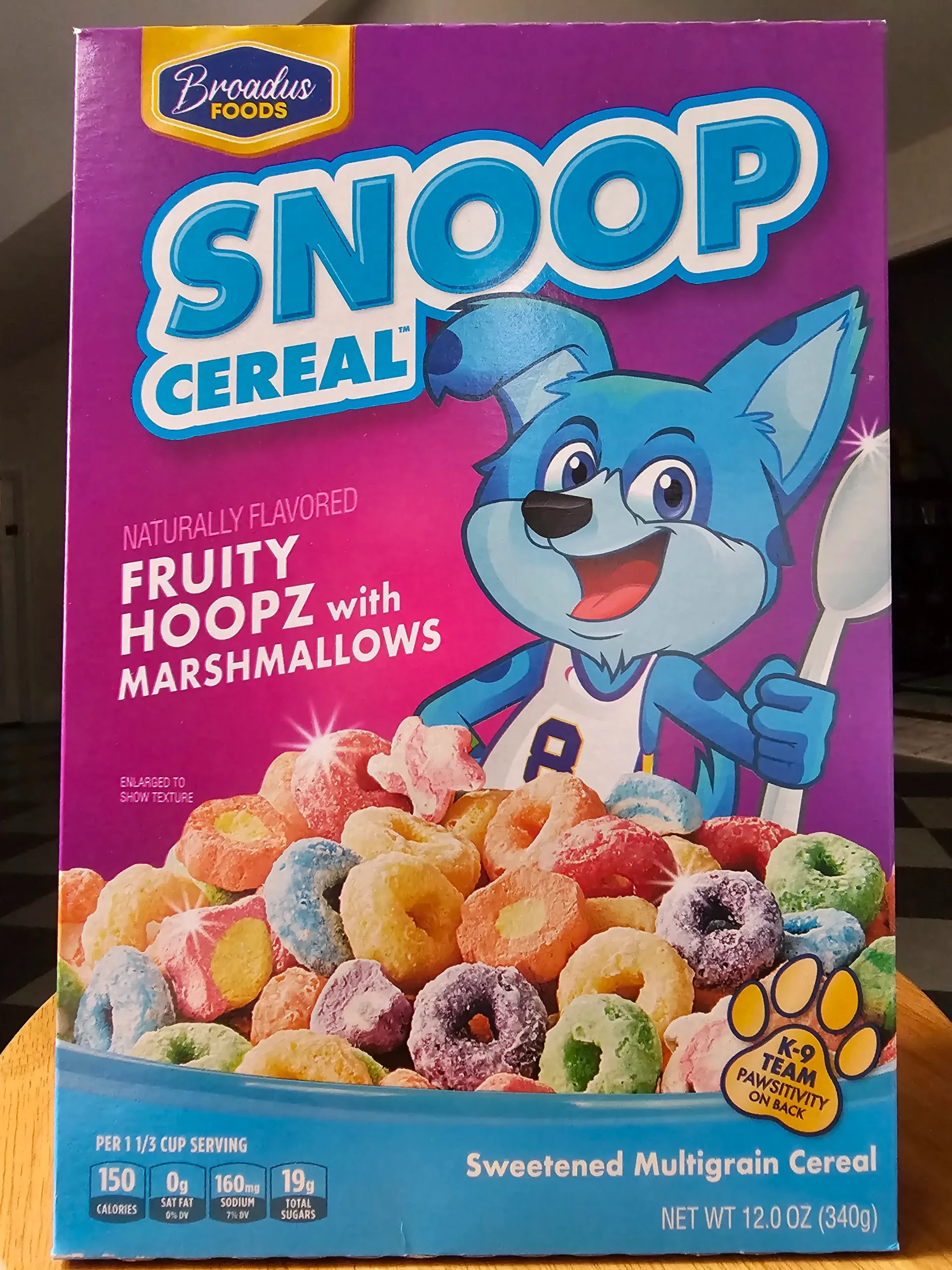 Front of Broadus Foods Snoop Cereal Fruity Hoopz with Marshmallows cereal box.