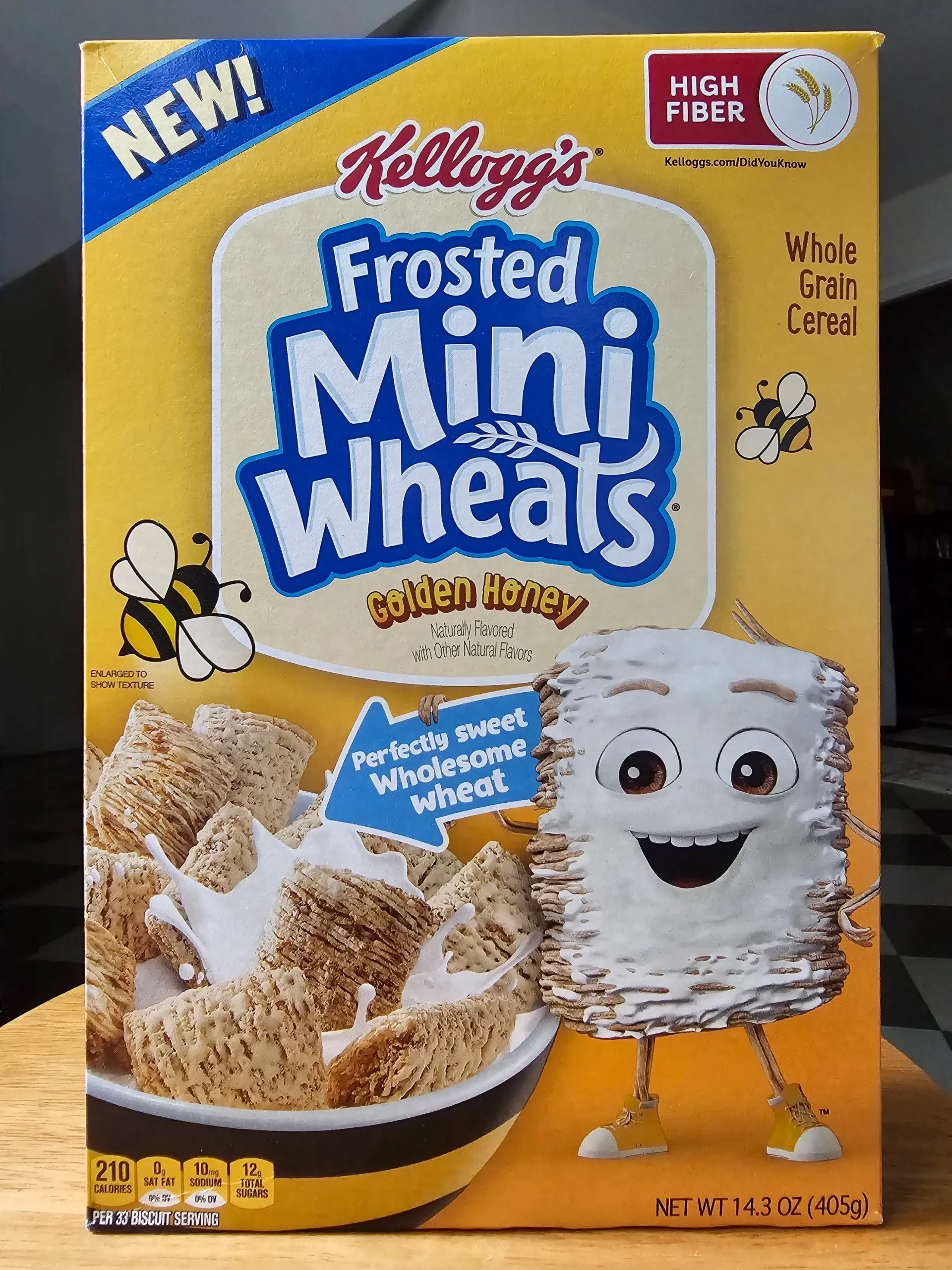 Front of Kellogg's Golden Honey Frosted Mini Wheats cereal box.