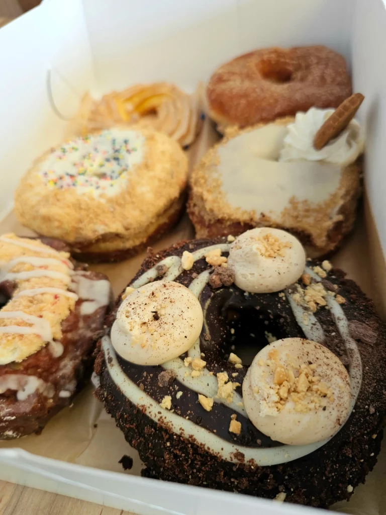 Six donuts from Providence Donuts (PVDonuts) in a box.