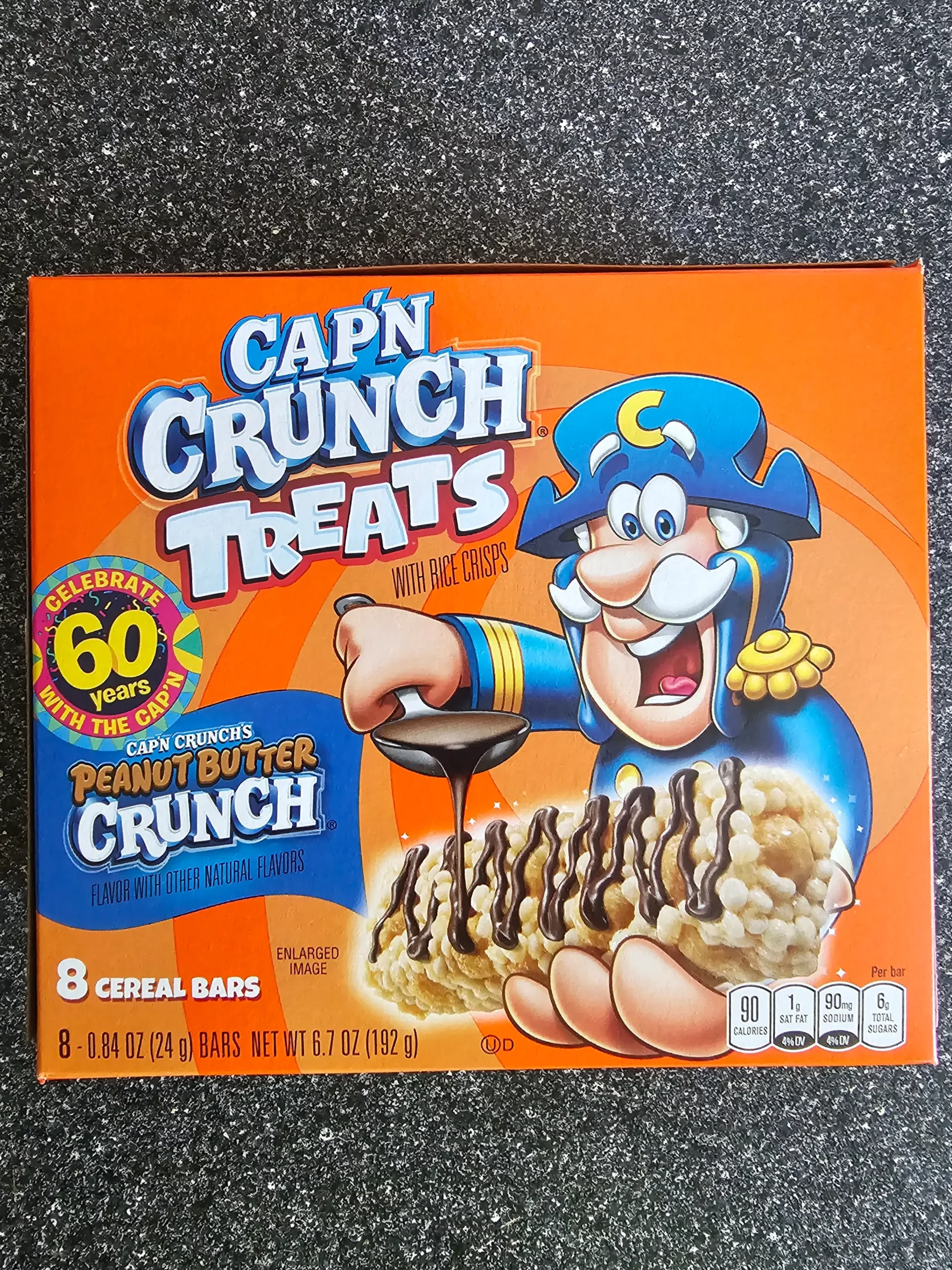 Front box of Cap'n Crunch Treats Peanut Butter crunch, 60th Birthday.