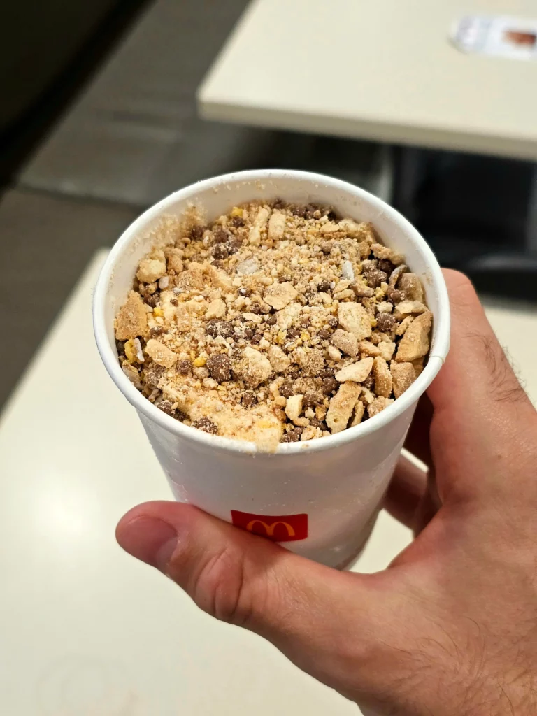 Holding a Peanut Butter Crunch Mcdonald's McFlurry.