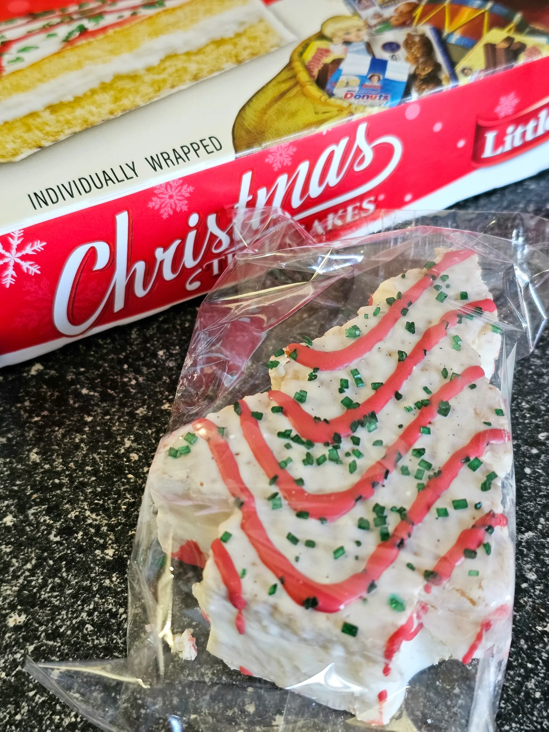 Front box and package of Little Debbie Christmas Tree Cakes.
