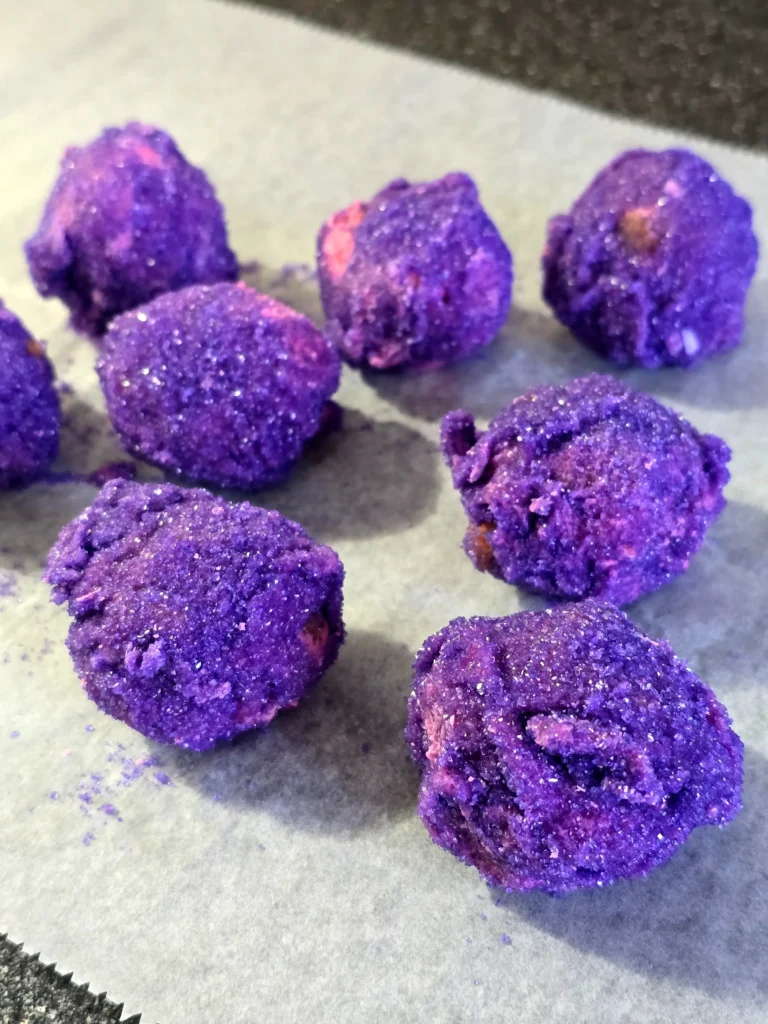 Sprinkle rolled strawberry marshmallow cake balls.