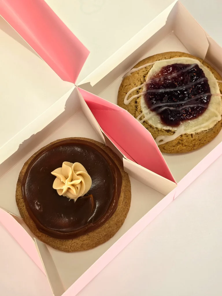 Crumbl Cookie's Dulce De Leches and Raspberry Danish.