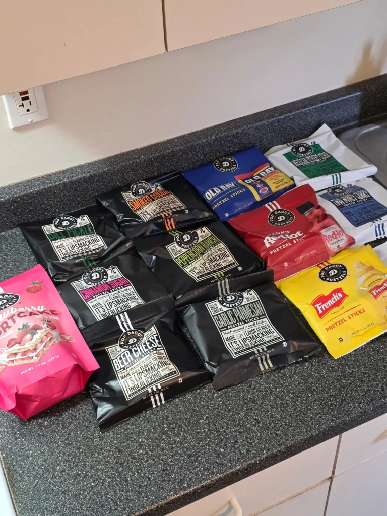 pop daddy pretzel sampler pack: Strawberry Shortcake, French’s, Frank’s RedHot, Old Bay, Maple & Brown Butter, Thai Curry Honey, Birthday Cake, Beer Cheese, Dill Pickle, Smoked Gouda, Cinnamon Sugar, Peppercorn Ranch, Garlic Parmesan, Mexican Street Corn.