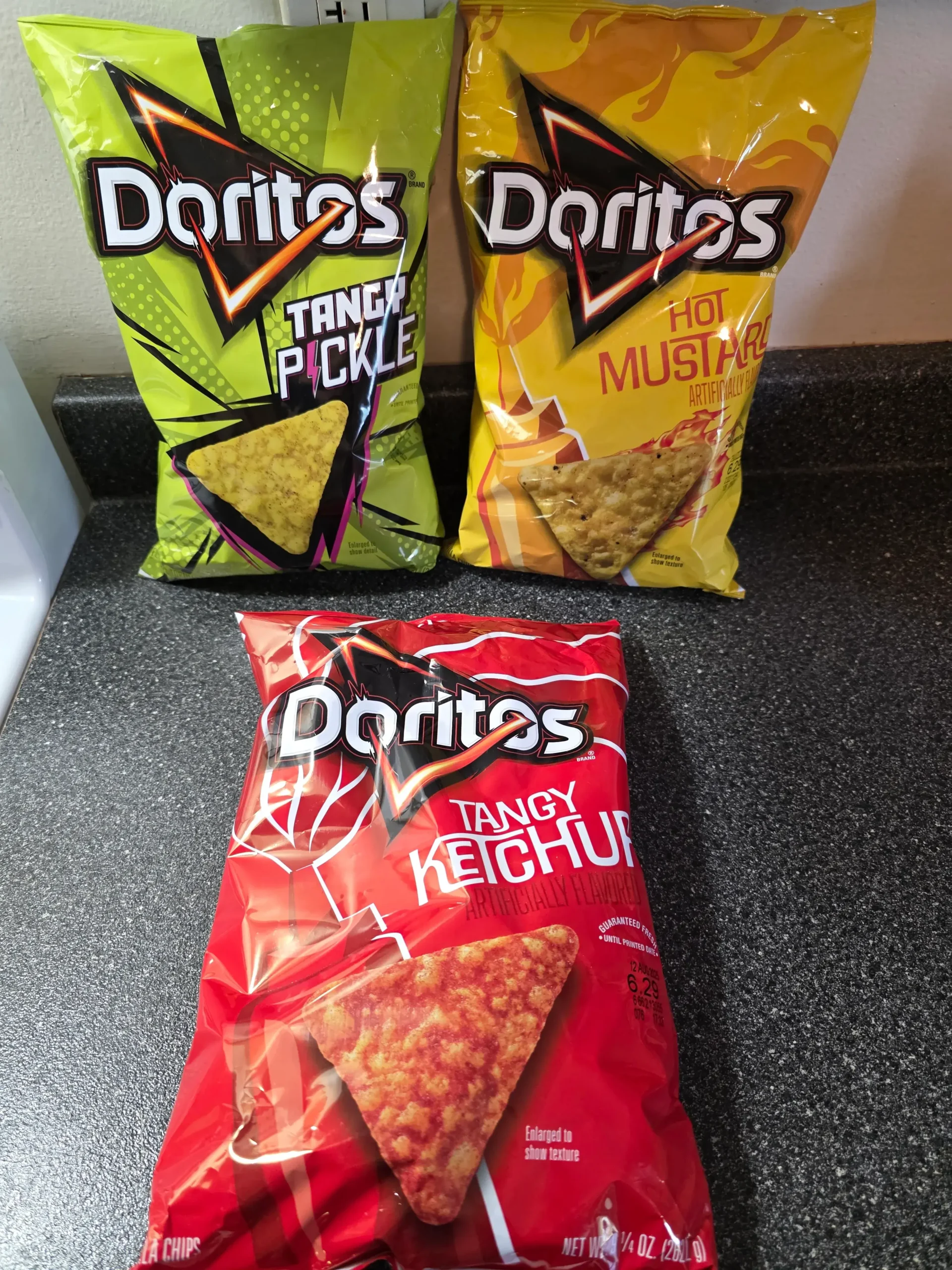 Doritos: Tangy Pickle, Hot Mustard, & Tangy Ketchup.