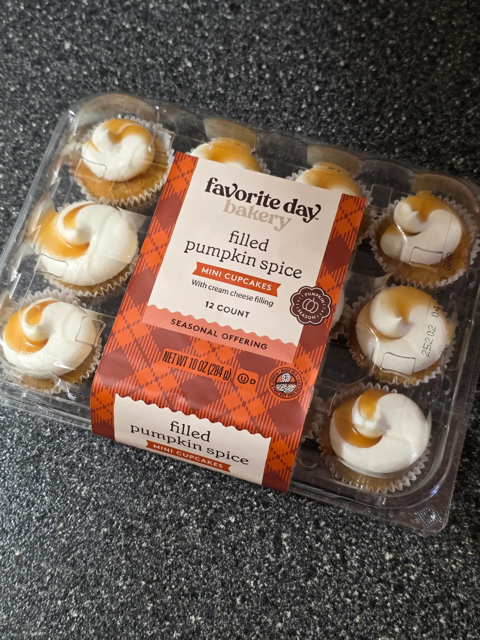 Favorite Day Bakery Filled Pumpkin Spice Mini Cupcakes with Cream Cheese Frosting.