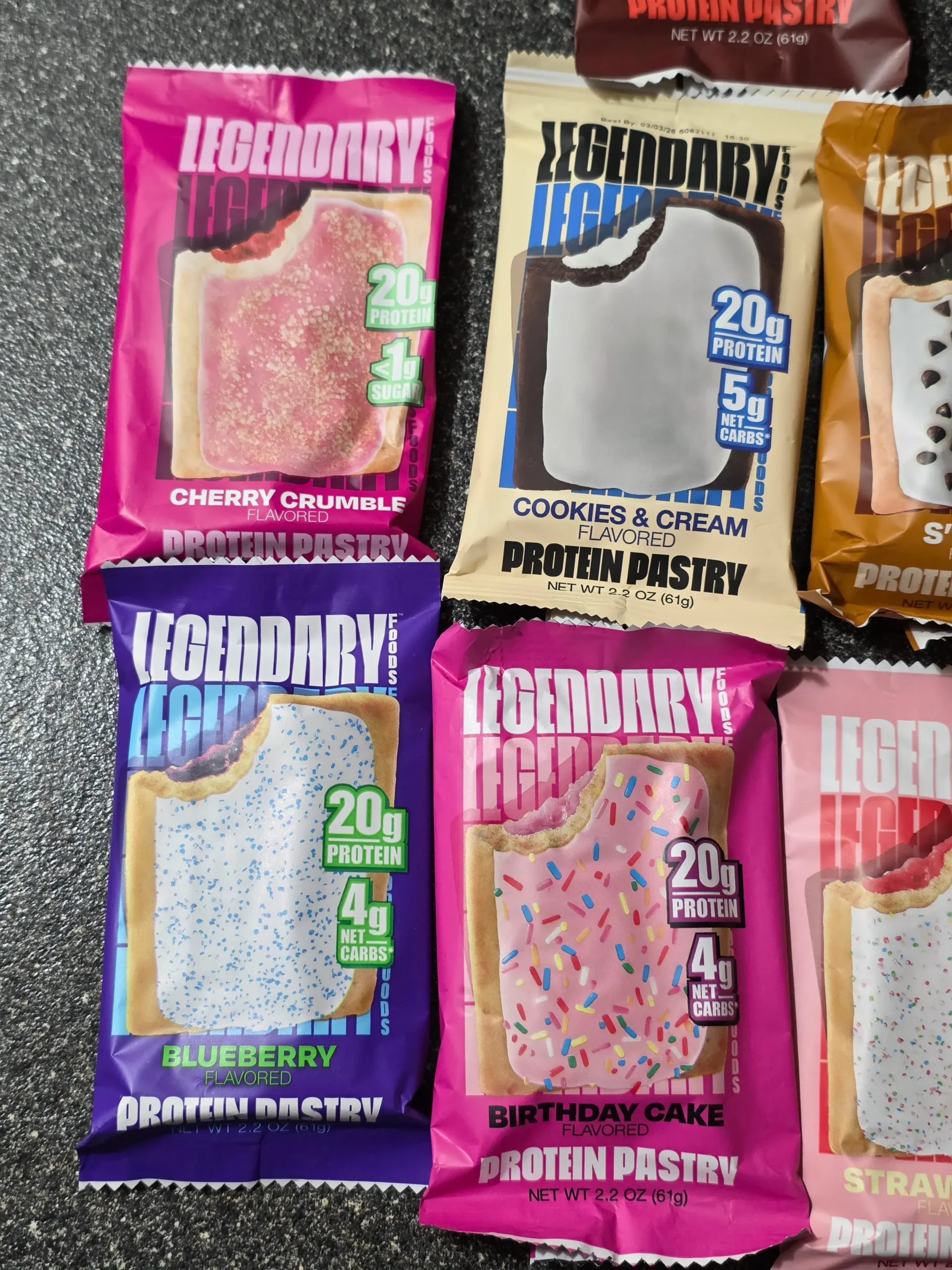 Legendary Foods Cake Style Protein Pastry "Pop-Tarts": Chocolate Cake, Cherry Crumble, Cookies & Cream, S'mores, Hot Fudge Sundae, Blueberry, Birthday Cake, Strawberry, and Brown Sugar Cinnamon.