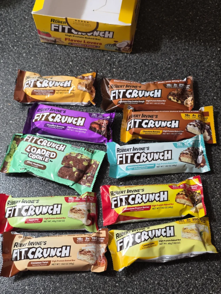 Robert Irvine's FITCRUNCH Protein Bars, including Flavor Lover's Variety pack: Chocolate Peanut Butter, Chocolate Banana, Chocolate Chip Cookie Dough, Chocolate Brownie, Chocolate Coconut Almond, Cinnamon Twist, Milk & Cookies, Lemon Cake, Apple Pie, and Mint Madness Loaded Cookie.
