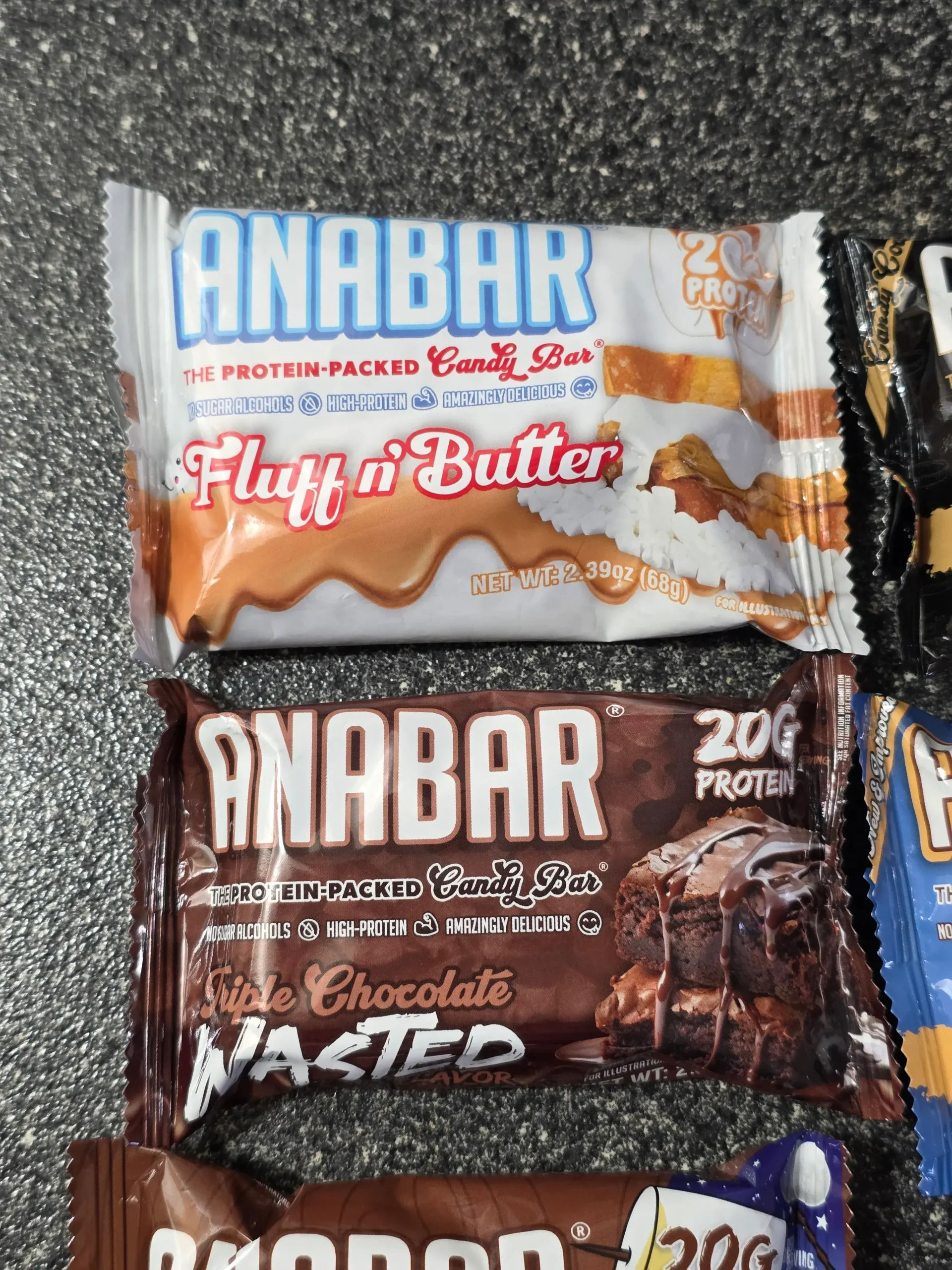 Anabar Variety Pack: Fluff n' Butter, Death by Peanut Butter, Triple Chocolate Wasted, Monster Cookie Crunch, Milk Chocolate Campfire S'mores, and White Chocolate Cookies & Cream.