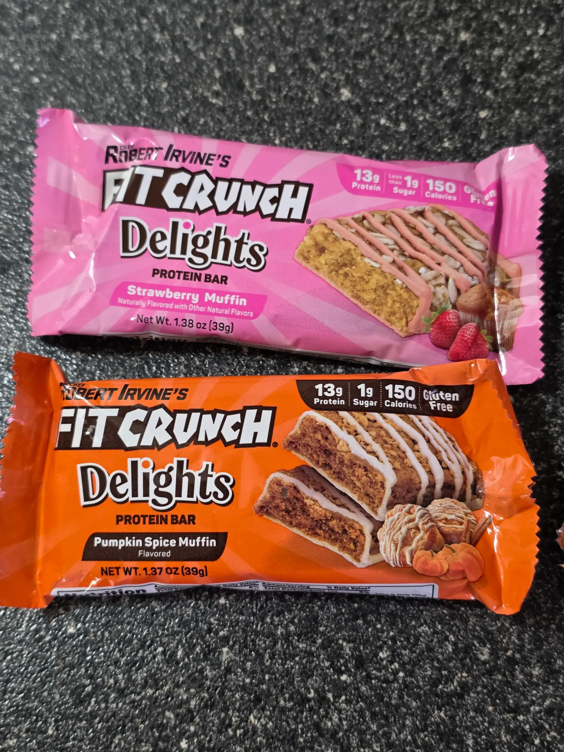 FITCRUNCH Delights: Cinnamon Roll, Oatmeal Chocolate Chip, Pumpkin Spice Muffin and Strawberry Muffin.