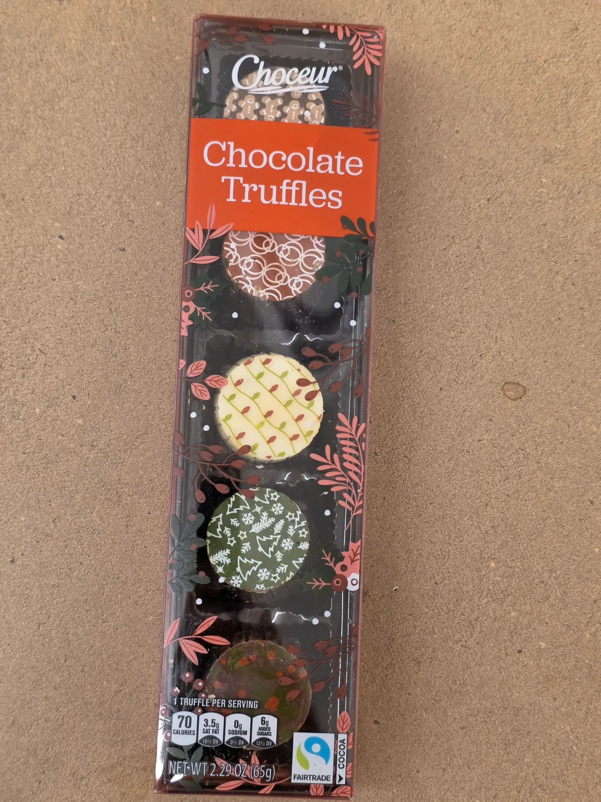 Choceur Christmas Holiday Chocolate Truffles: Milk Chocolate Gingerbread, Dark Chocolate Cherry, White Chocolate Snack Cake, Dark Chocolate Ganache, and Milk Chocolate Ganache.