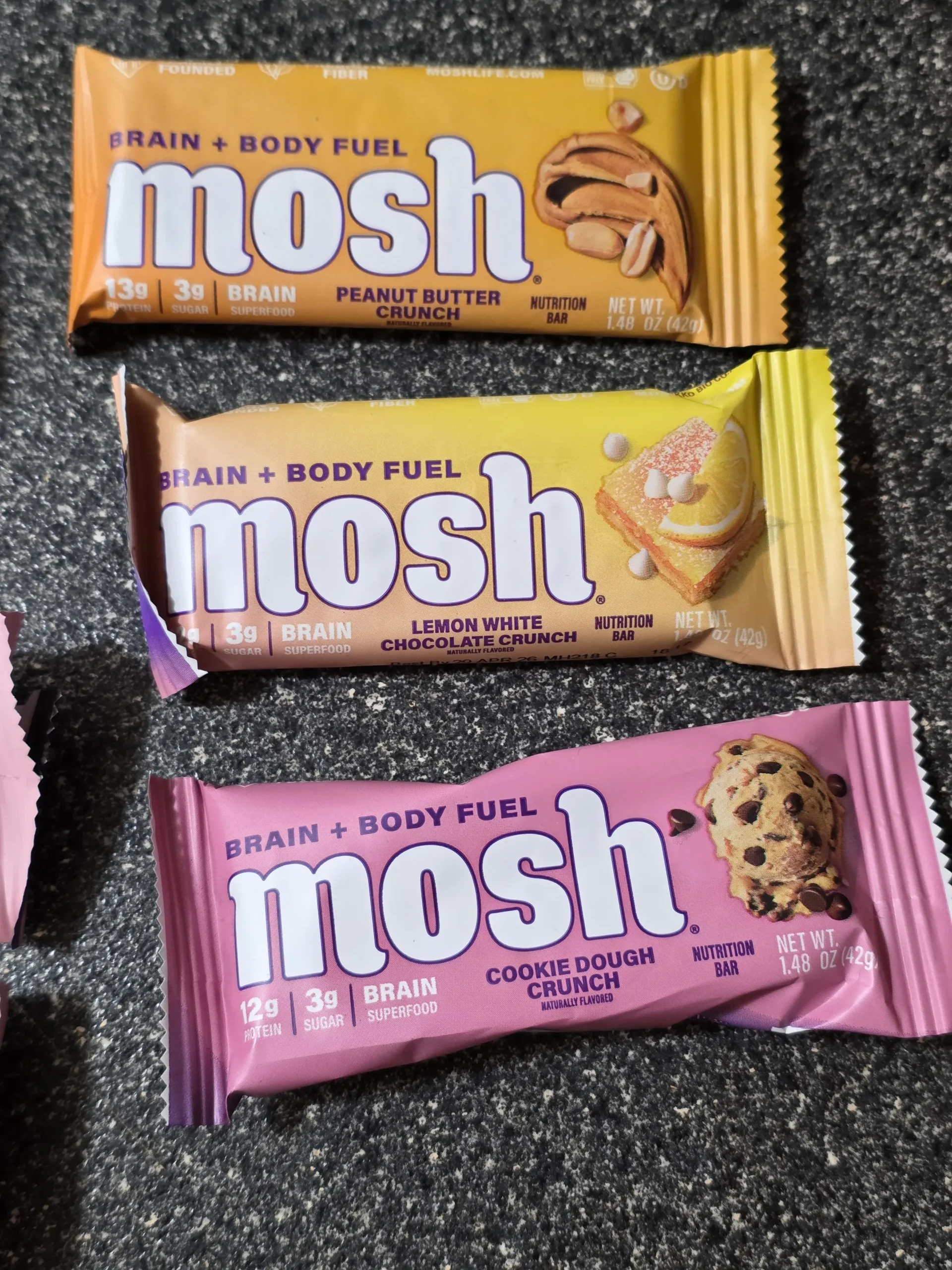 Mosh Protein Bar Trial Pack: I picked these up from their TikTok shop, which includes the following six flavors: Cookie Dough Crunch, Peanut Butter Chocolate Crunch, Lemon White Chocolate Crunch, and Raspberry White Chocolate Crunch.