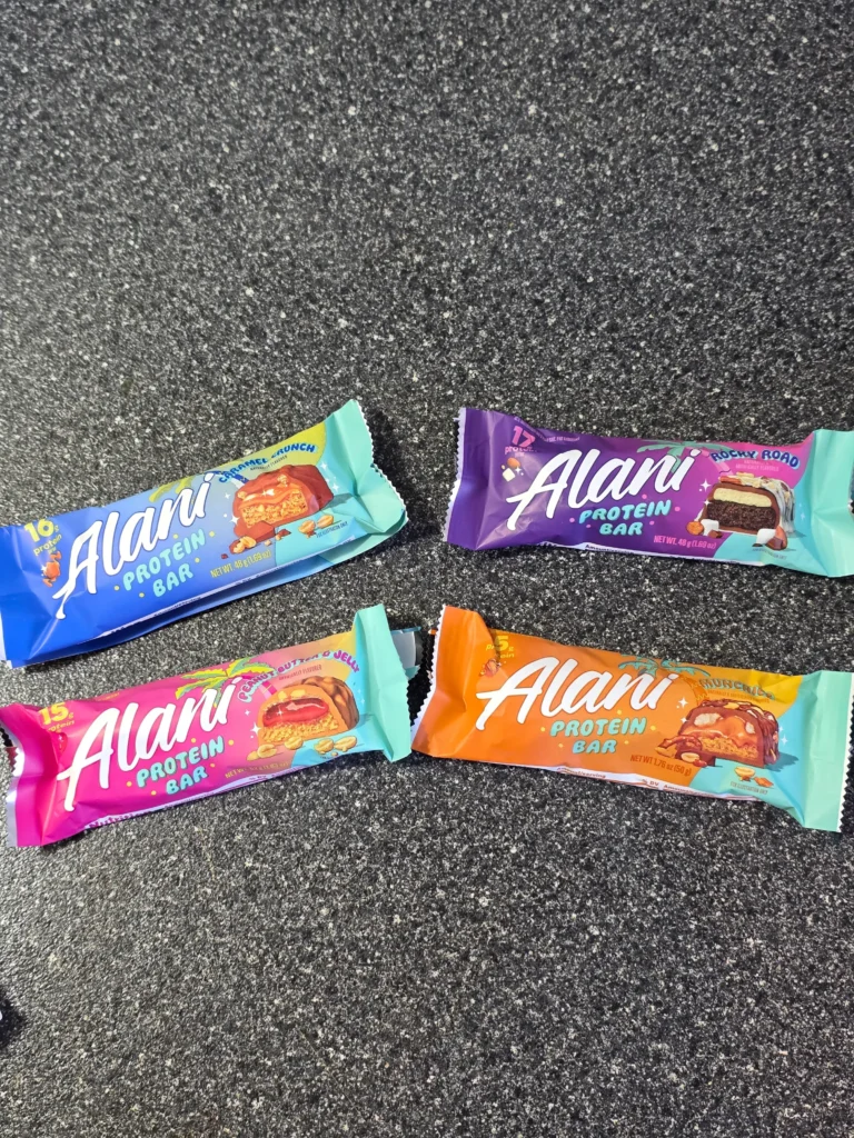 Alani Protein Bar: Caramel Crunch, Rocky Road, Peanut Butter & Jelly, and Munchies.