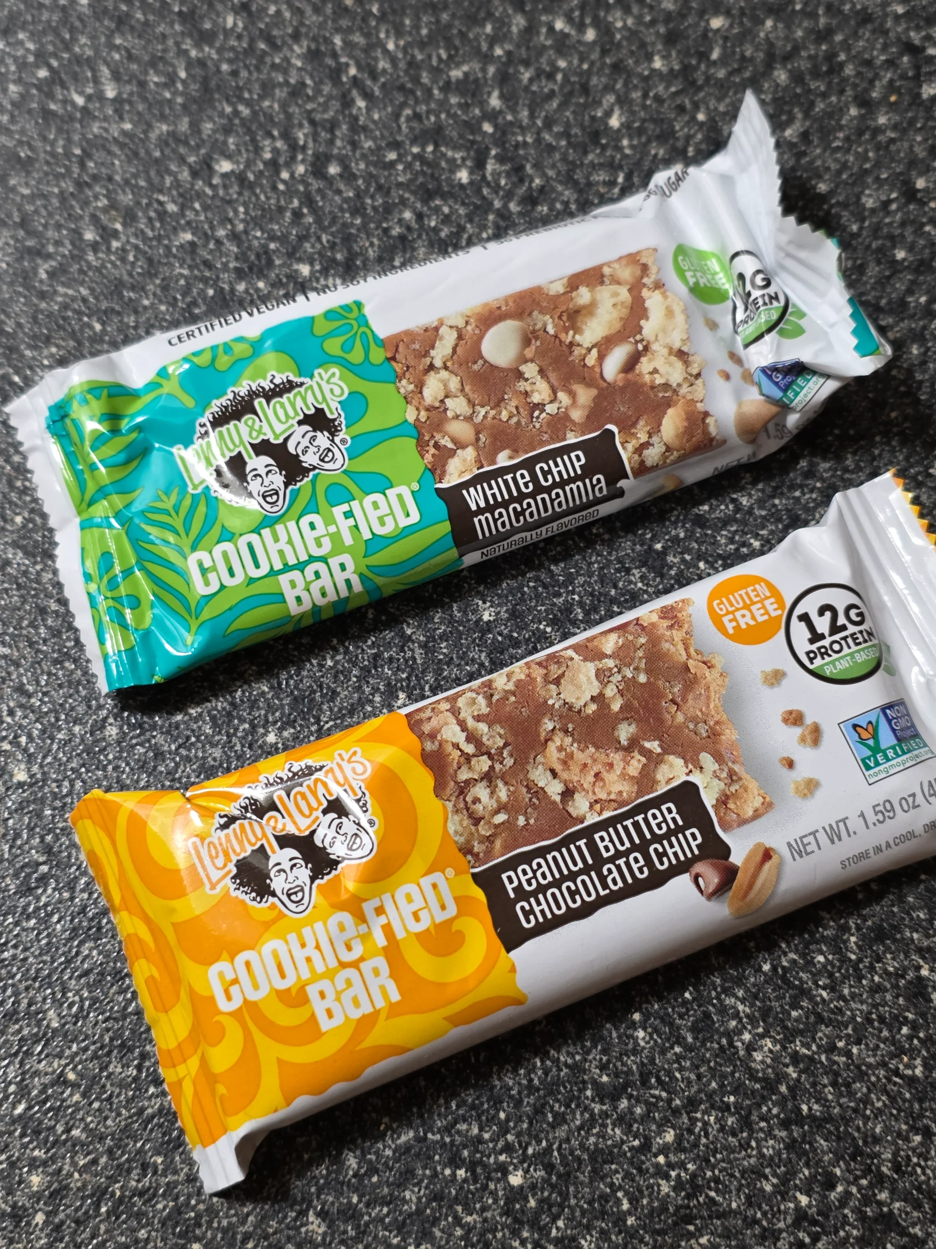 Lenny & Larry's Cookie-fied plant-based Protein Bar Variety Pack: Chocolate Chip Cookie Dough, Cookies & Creme, Peanut Butter Chocolate Chip, and White Chip Macadamia.