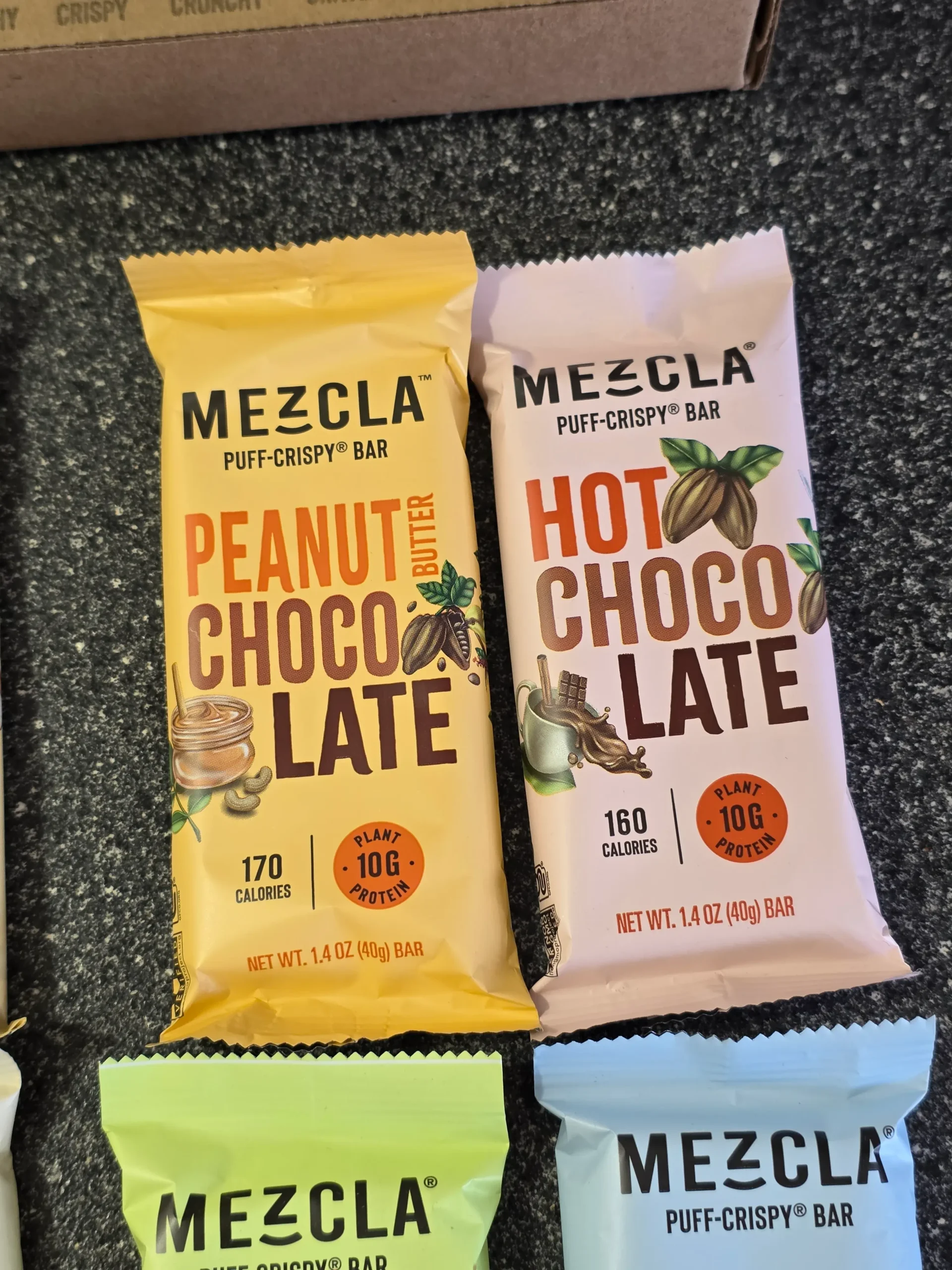 Mezcla Puff-Crispy Plant-Based Protein Bars Variety Pack: Peanut Butter Chocolate, Hot Chocolate, Pistachio Chocolate, Maple Blueberry, Hazelnut Chocolate, Almond Butter Chocolate, and Matcha Vanilla.