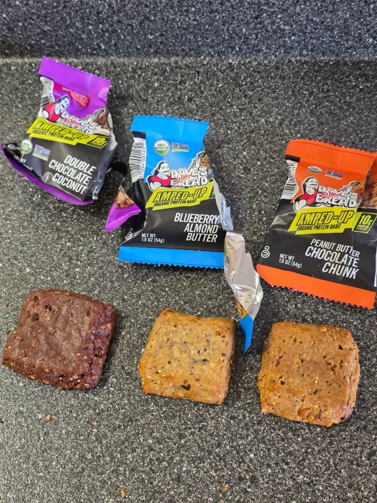 Dave's Killer Bread Amped-Up Protein Bars: Blueberry Almond Butter, Double Chocolate Coconut, and Peanut Butter Chocolate Chunk.