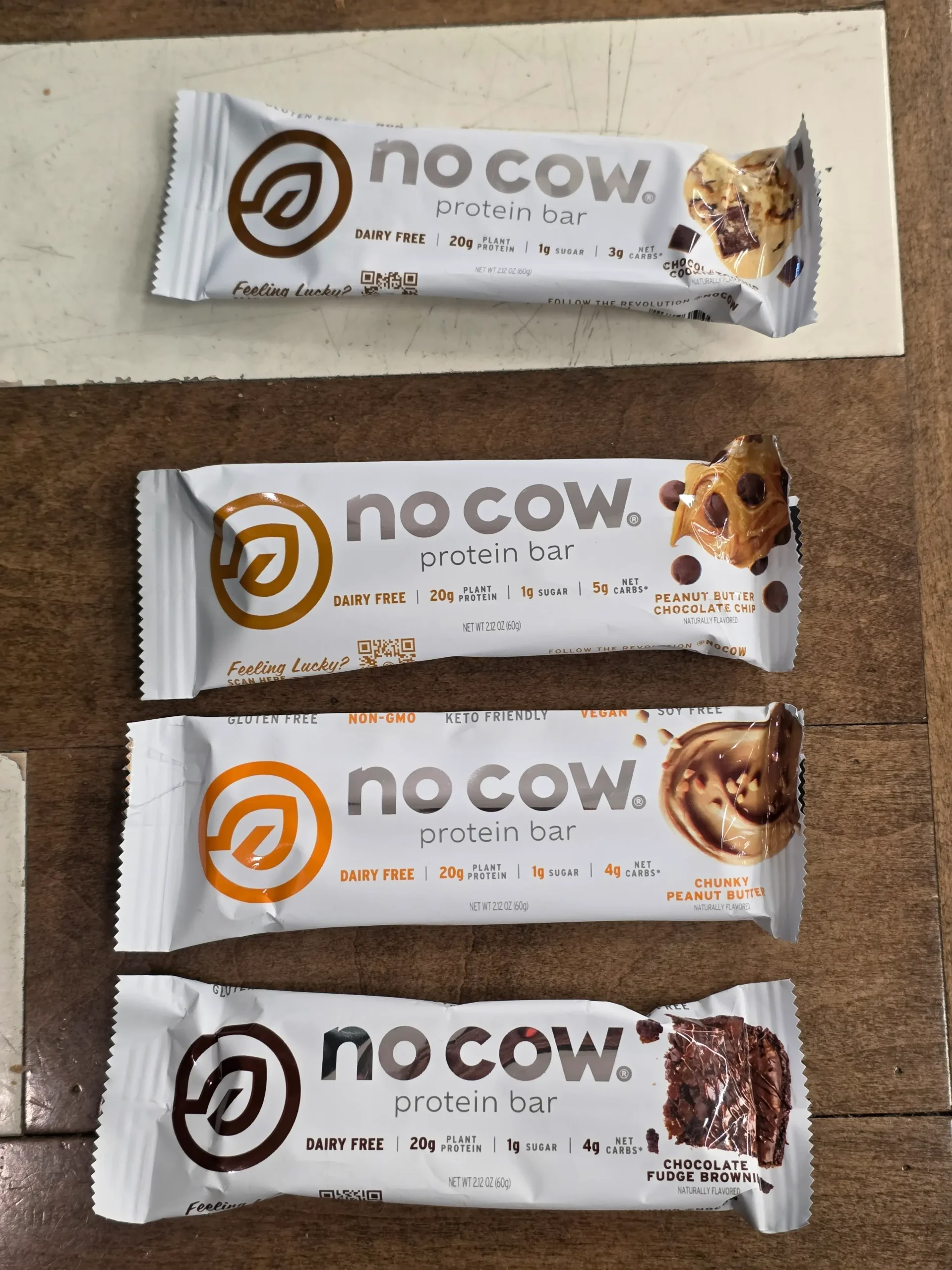 No Cow Protein Bars, Peanut Butter Chocolate Chip, Chunky Peanut Butter, Chocolate Fudge Brownie, and Chocolate Chip Cookie Dough.