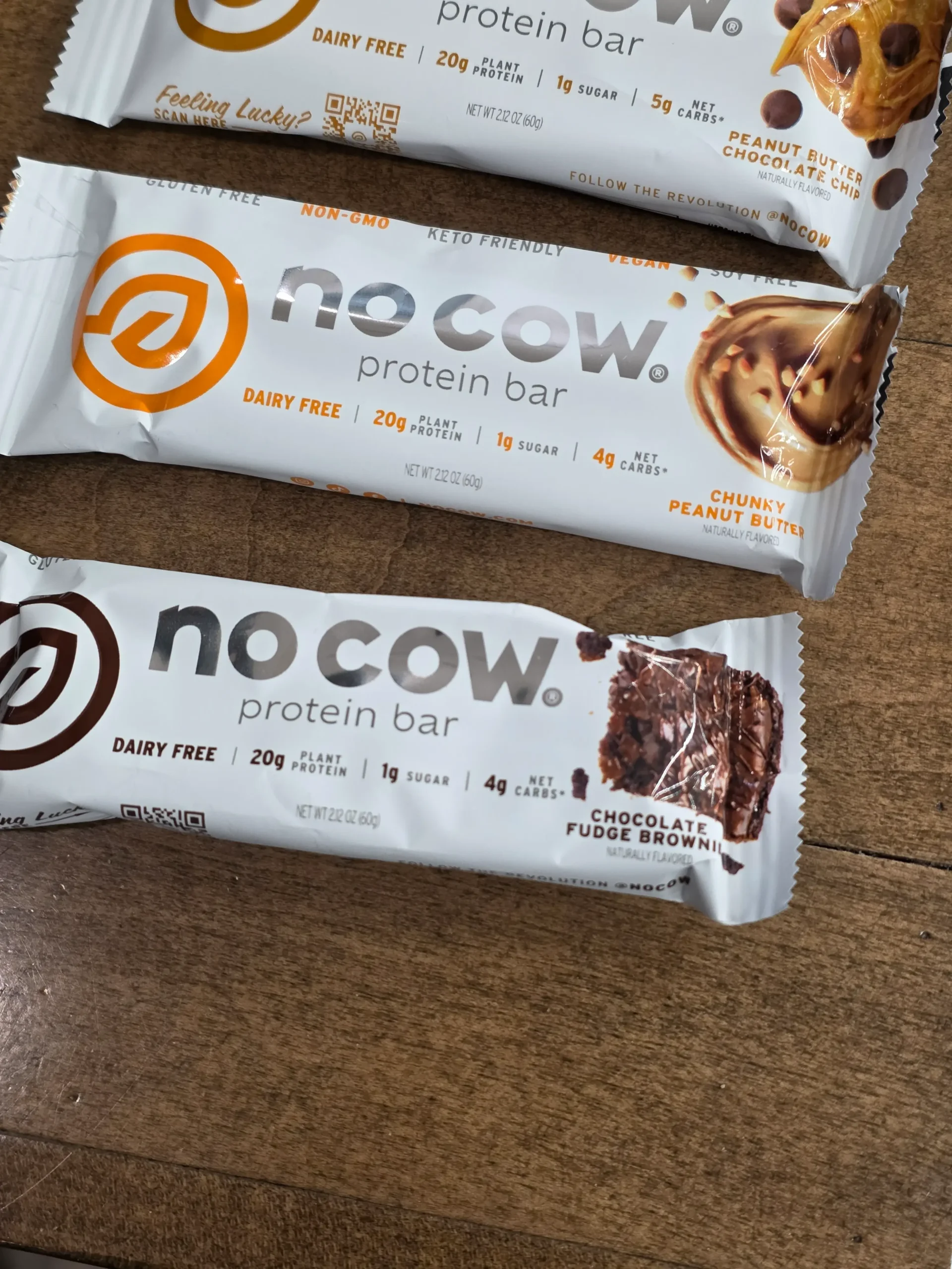 No Cow Protein Bars, Peanut Butter Chocolate Chip, Chunky Peanut Butter, Chocolate Fudge Brownie, and Chocolate Chip Cookie Dough.