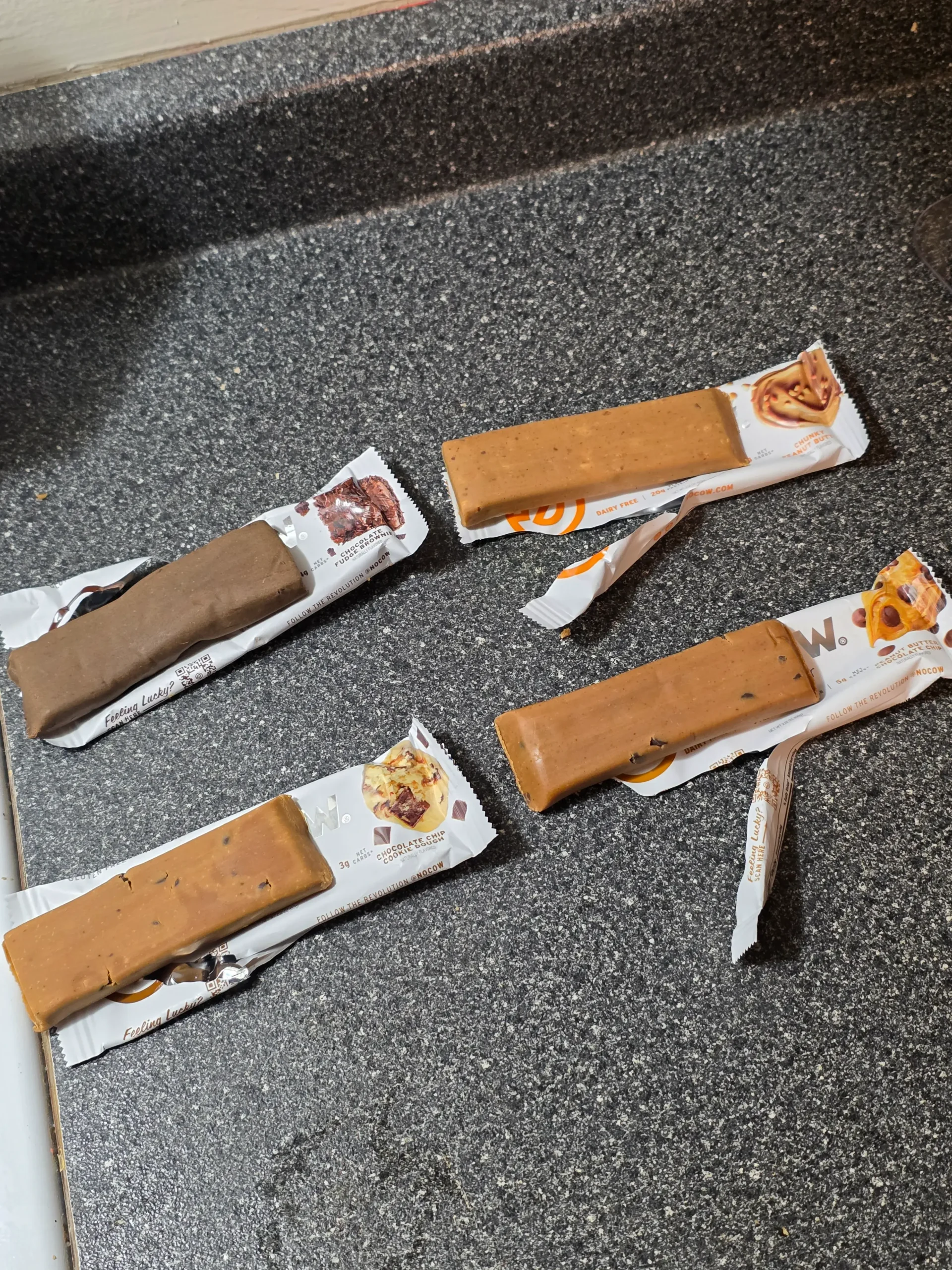 No Cow Protein Bars, Peanut Butter Chocolate Chip, Chunky Peanut Butter, Chocolate Fudge Brownie, and Chocolate Chip Cookie Dough.