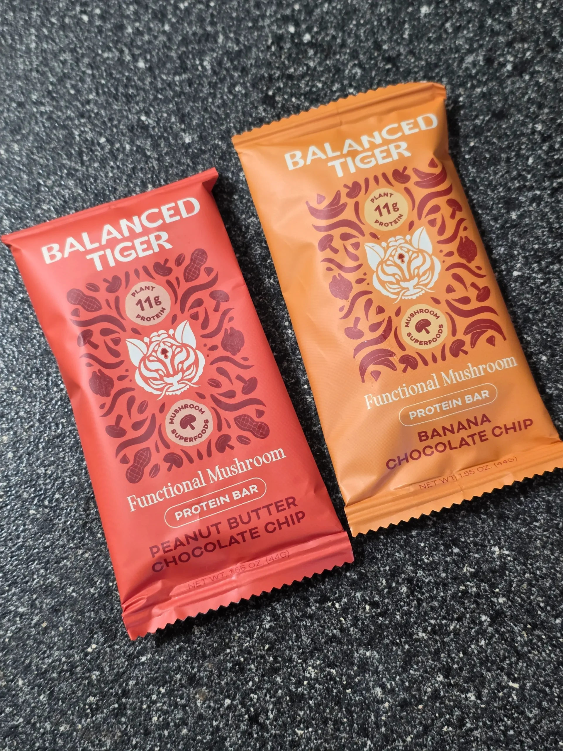 Balanced Tiger Mushroom Protein Bars, Chocolate Brownie, Banana Chocolate Chip, Mint Chocolate Chip, Vanilla Chai, Peanut Butter Chocolate, and Chocolate Chip Cookie Dough.