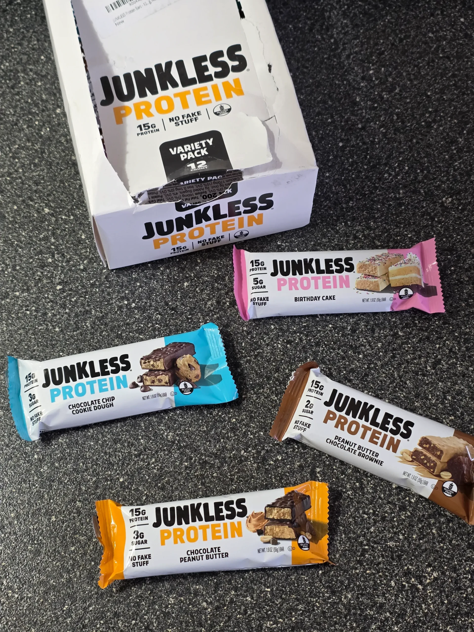 Junkless protein bars, Chocolate Peanut Butter, Birthday Cake, Chocolate Chip Cookie Dough, and Peanut Butter Chocolate Brownie.