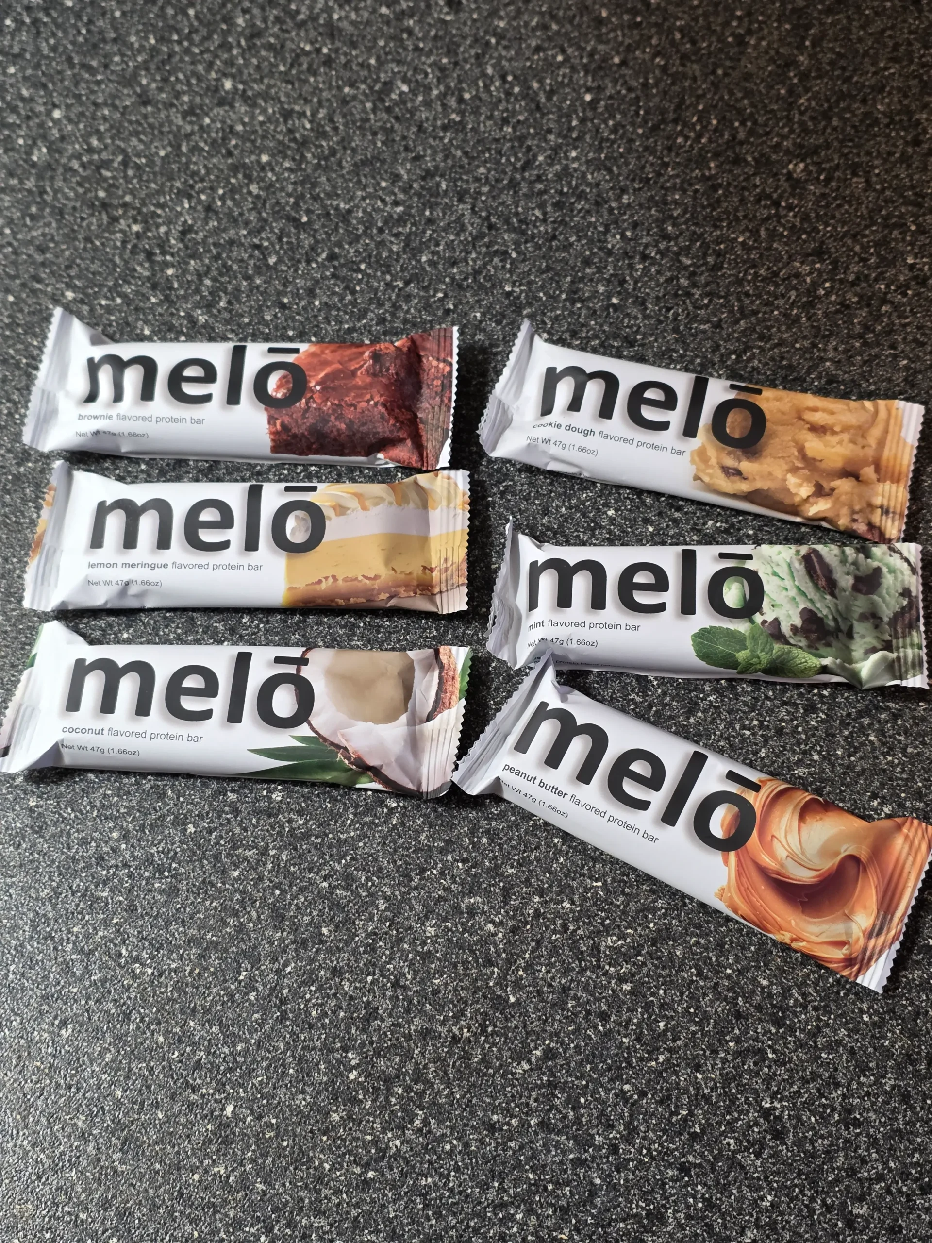 Melo Melō Protein Bars Brownie, Coconut, Cookie Dough, Lemon Meringue, Mint, and Peanut Butter.