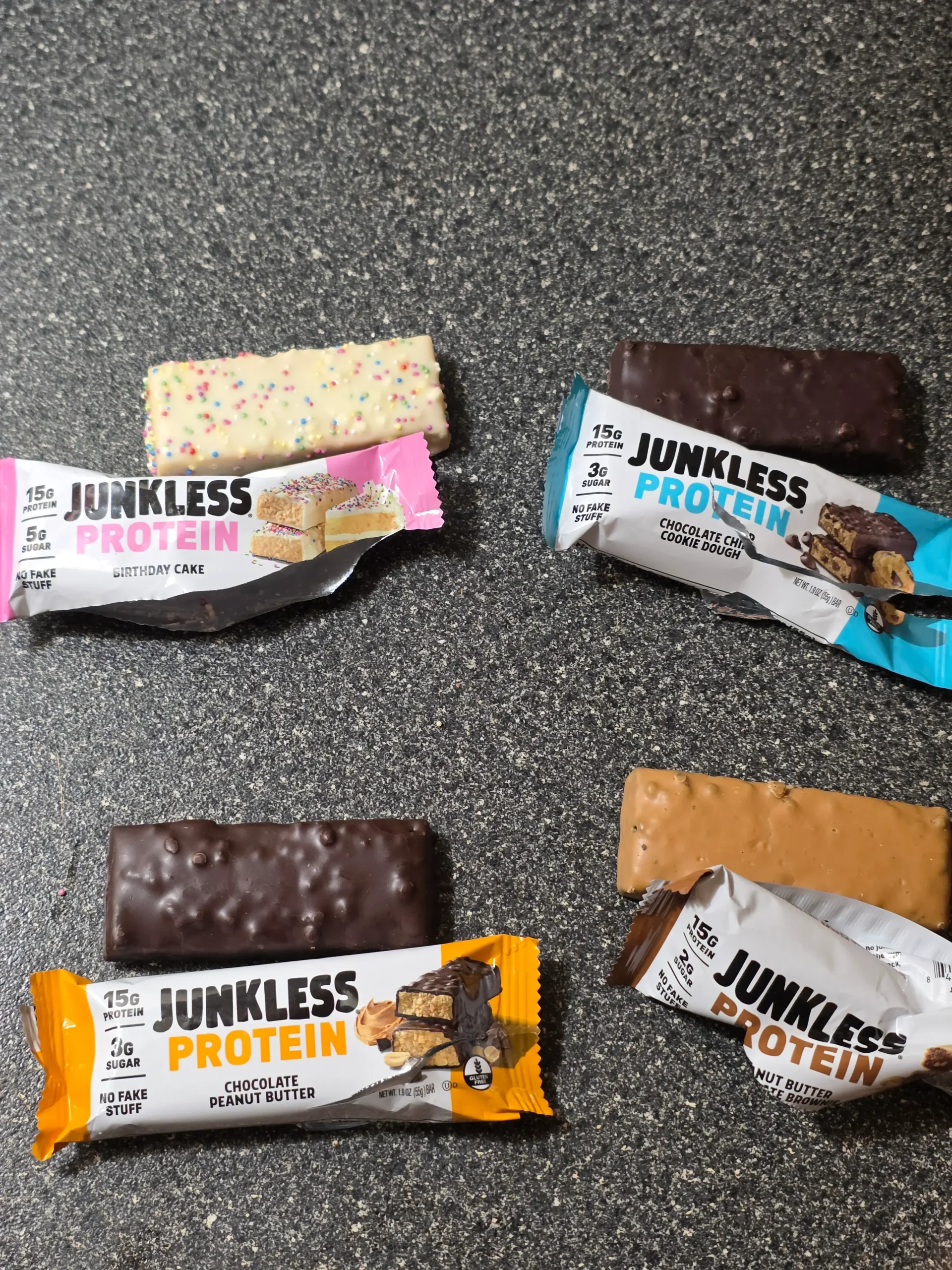 Junkless protein bars, Chocolate Peanut Butter, Birthday Cake, Chocolate Chip Cookie Dough, and Peanut Butter Chocolate Brownie.