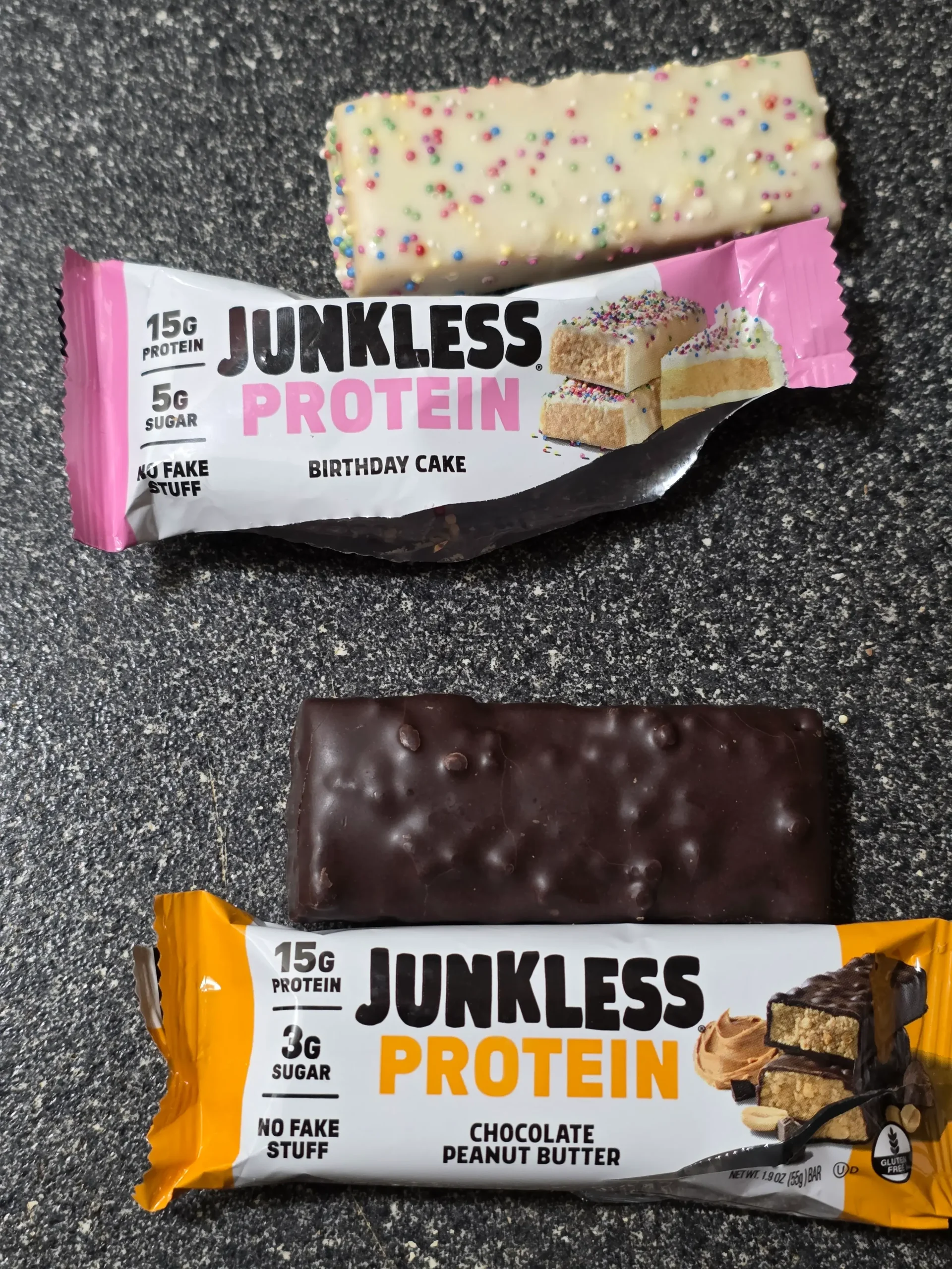 Junkless protein bars, Chocolate Peanut Butter, Birthday Cake, Chocolate Chip Cookie Dough, and Peanut Butter Chocolate Brownie.
