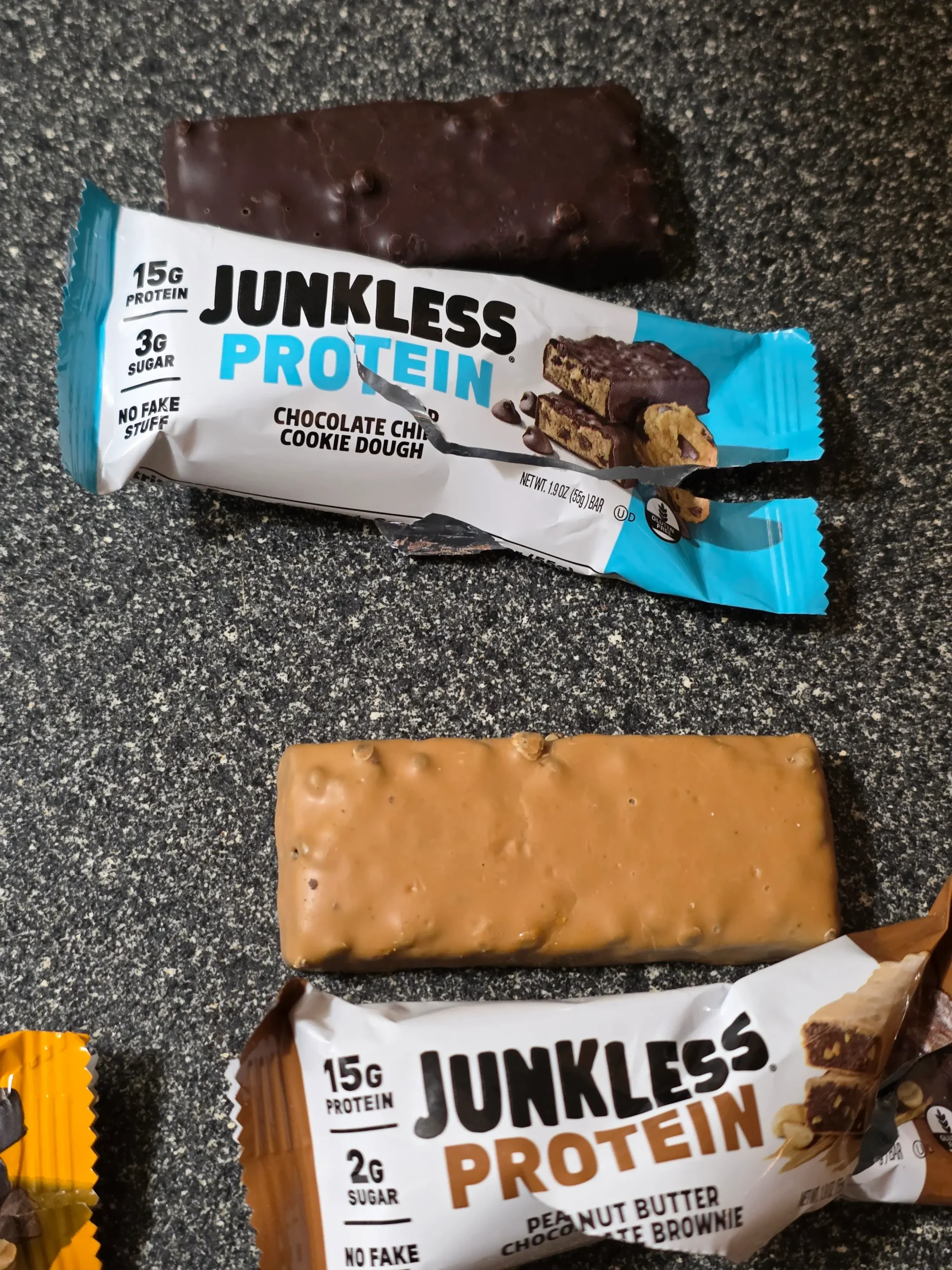 Junkless protein bars, Chocolate Peanut Butter, Birthday Cake, Chocolate Chip Cookie Dough, and Peanut Butter Chocolate Brownie.