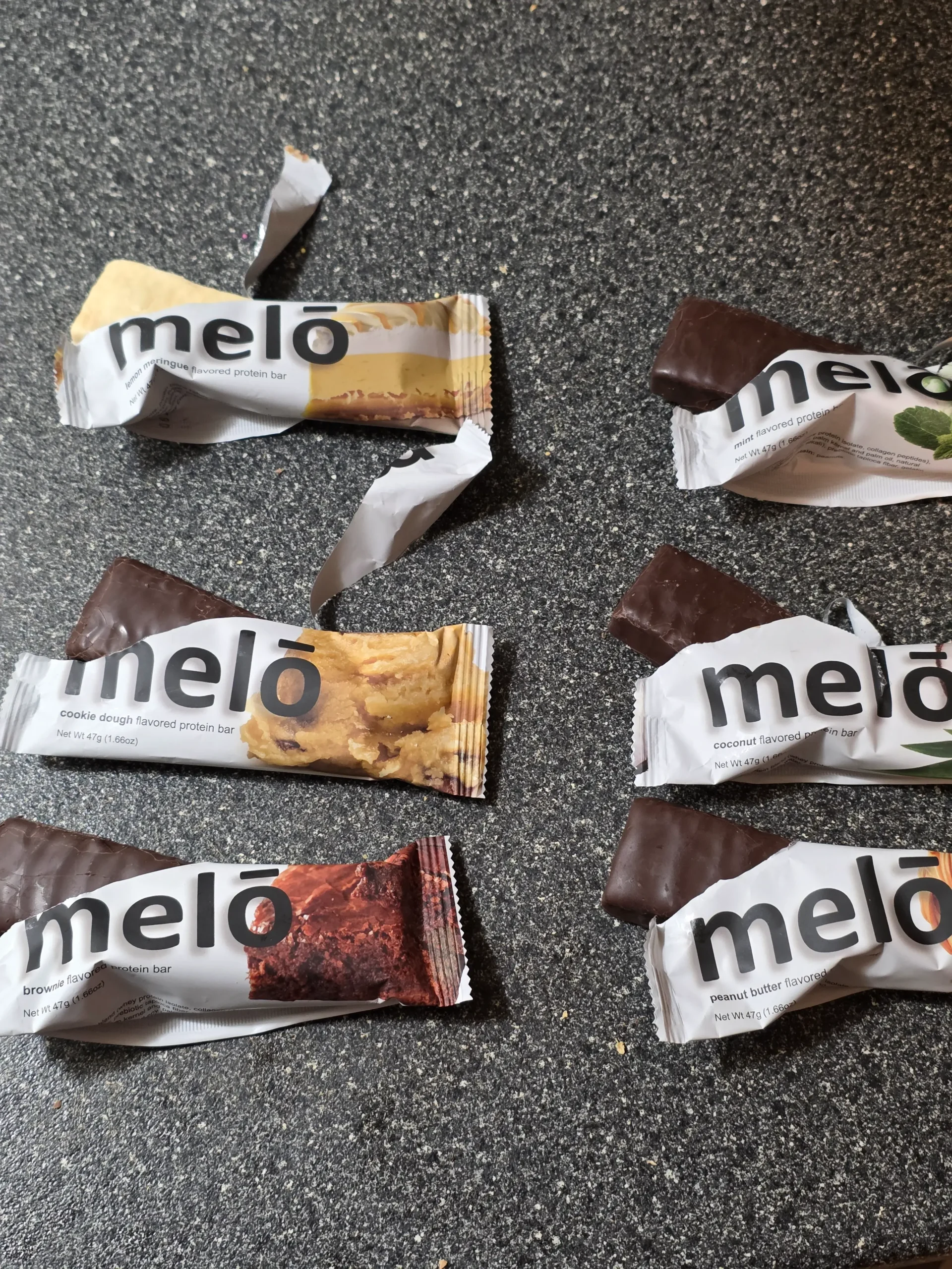 Melo Melō Protein Bars Brownie, Coconut, Cookie Dough, Lemon Meringue, Mint, and Peanut Butter.