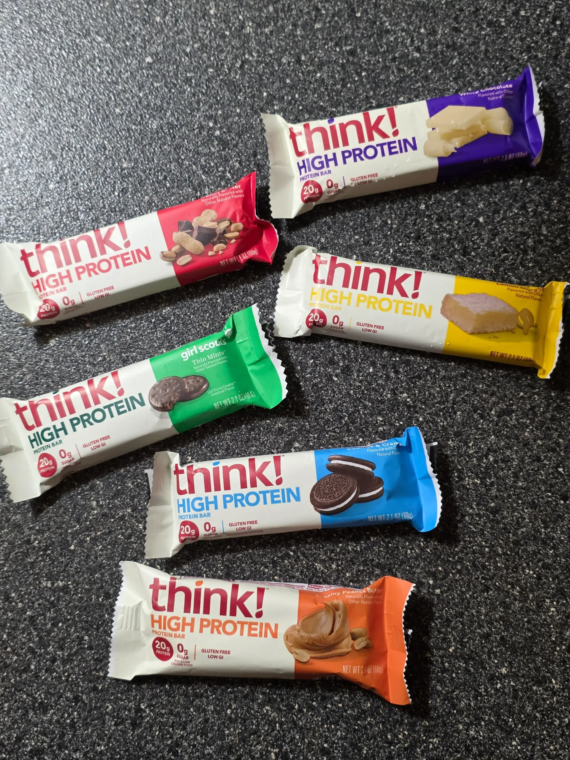 think! Think Protein Bars Girl Scouts Thin Mints, Chunky Peanut Butter, Lemon Delight, Cookies & Creme, White Chocolate, and Creamy Peanut Butter.