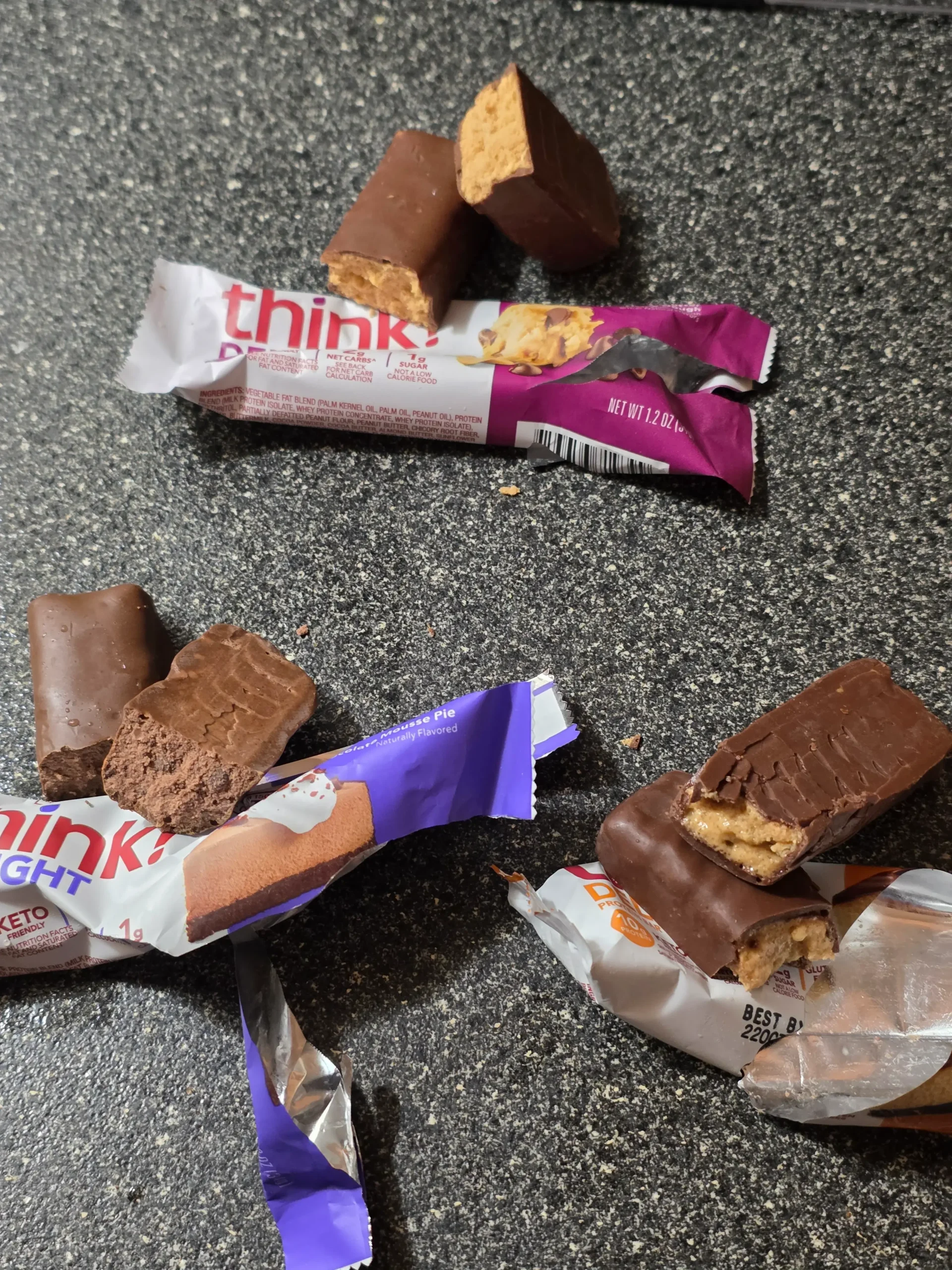 think! Delight protein bars, Chocolate Peanut Butter Cookie Dough, Chocolate Peanut Butter Pie, and Chocolate Mousse Pie.