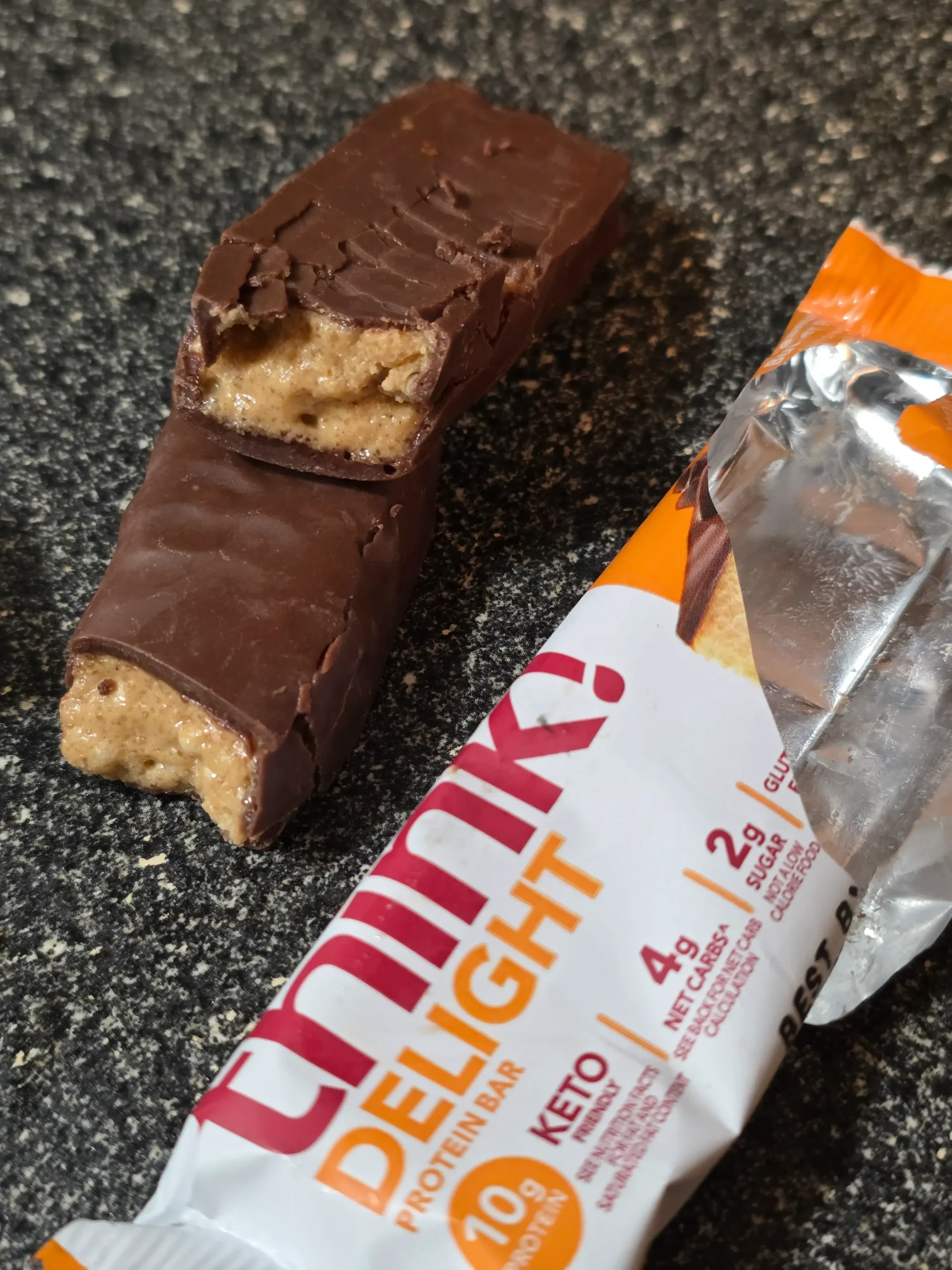 think! Delight protein bars, Chocolate Peanut Butter Cookie Dough, Chocolate Peanut Butter Pie, and Chocolate Mousse Pie.