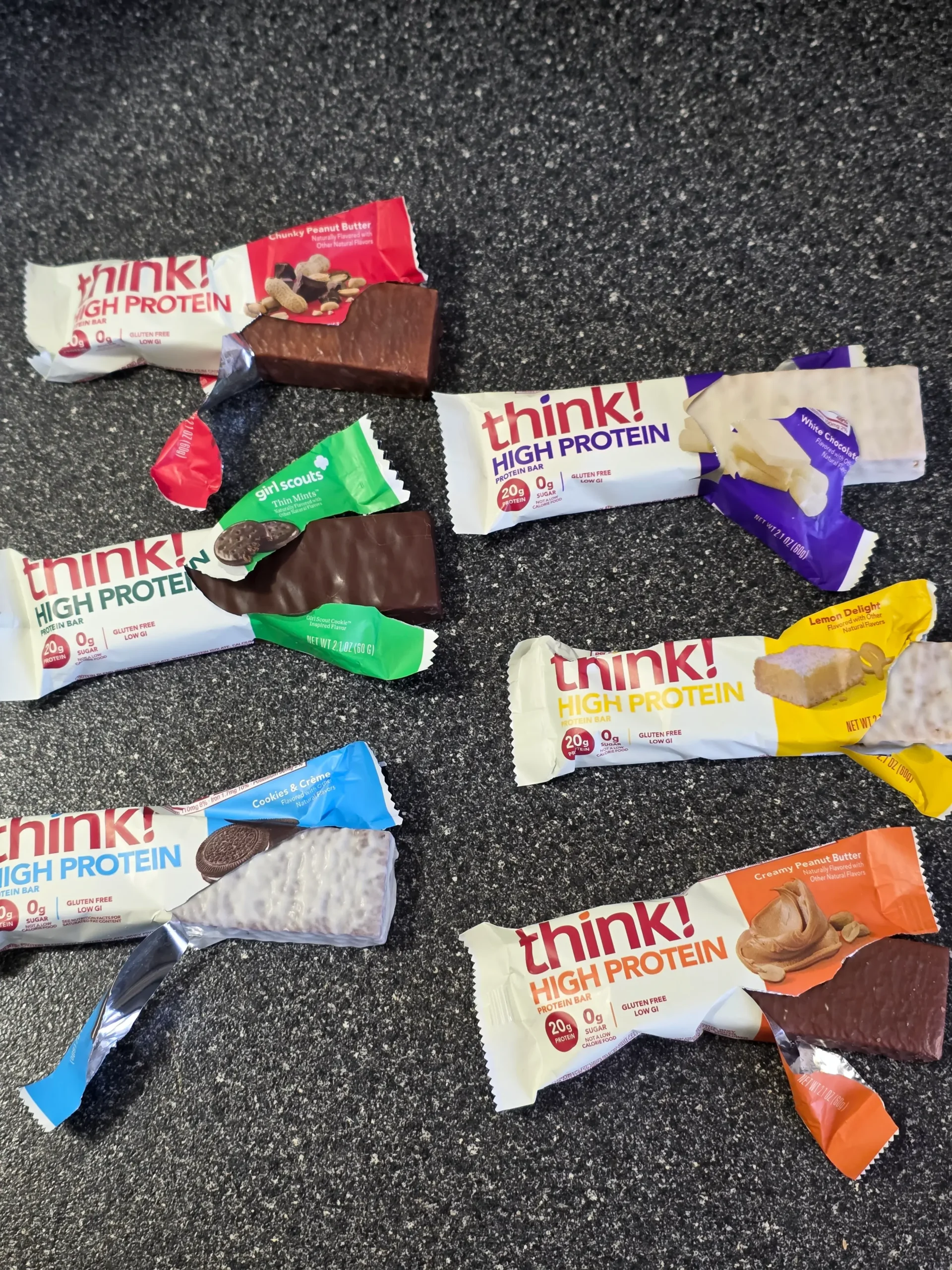 think! Think Protein Bars Girl Scouts Thin Mints, Chunky Peanut Butter, Lemon Delight, Cookies & Creme, White Chocolate, and Creamy Peanut Butter.