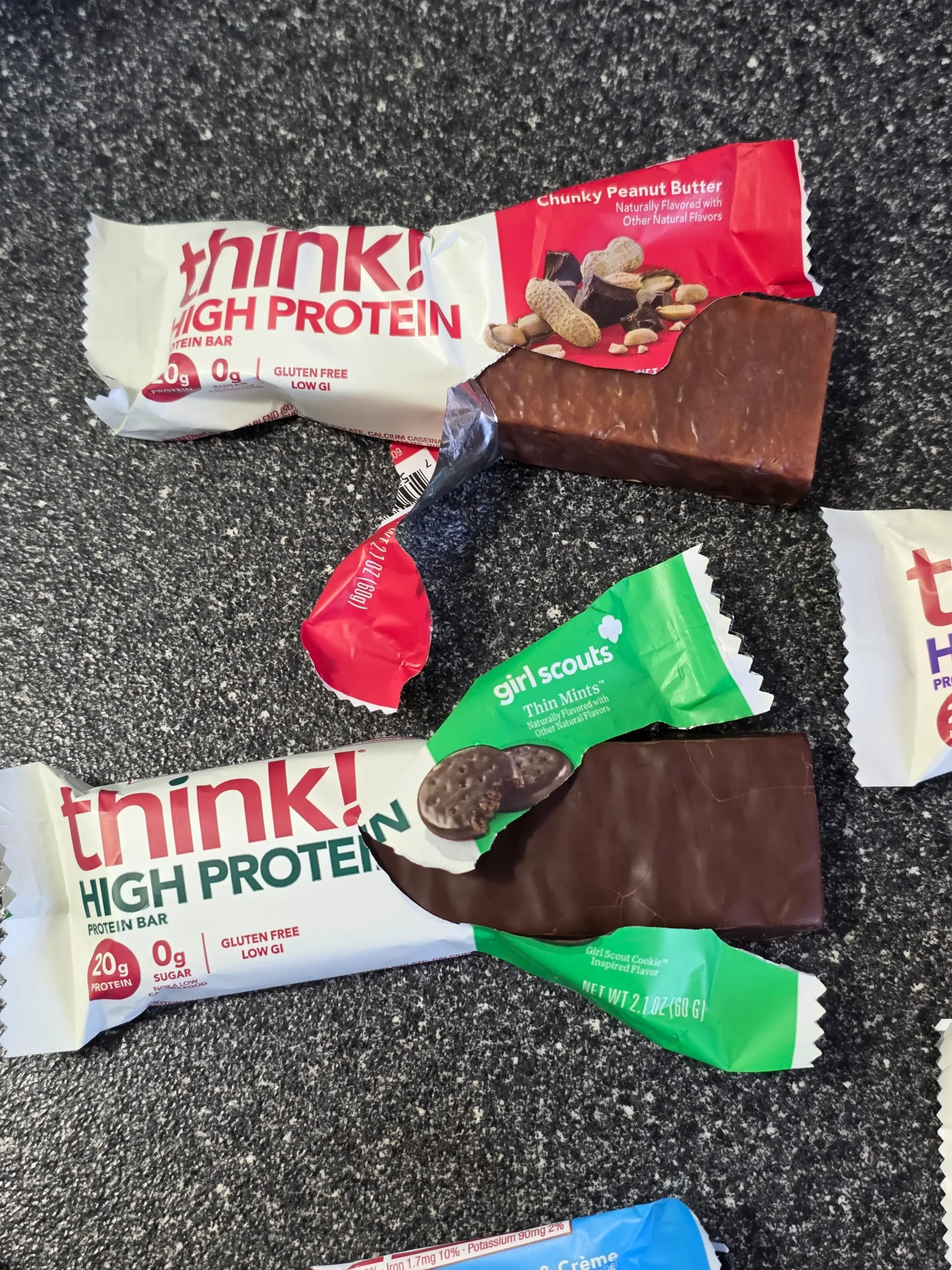 think! Think Protein Bars Girl Scouts Thin Mints, Chunky Peanut Butter, Lemon Delight, Cookies & Creme, White Chocolate, and Creamy Peanut Butter.