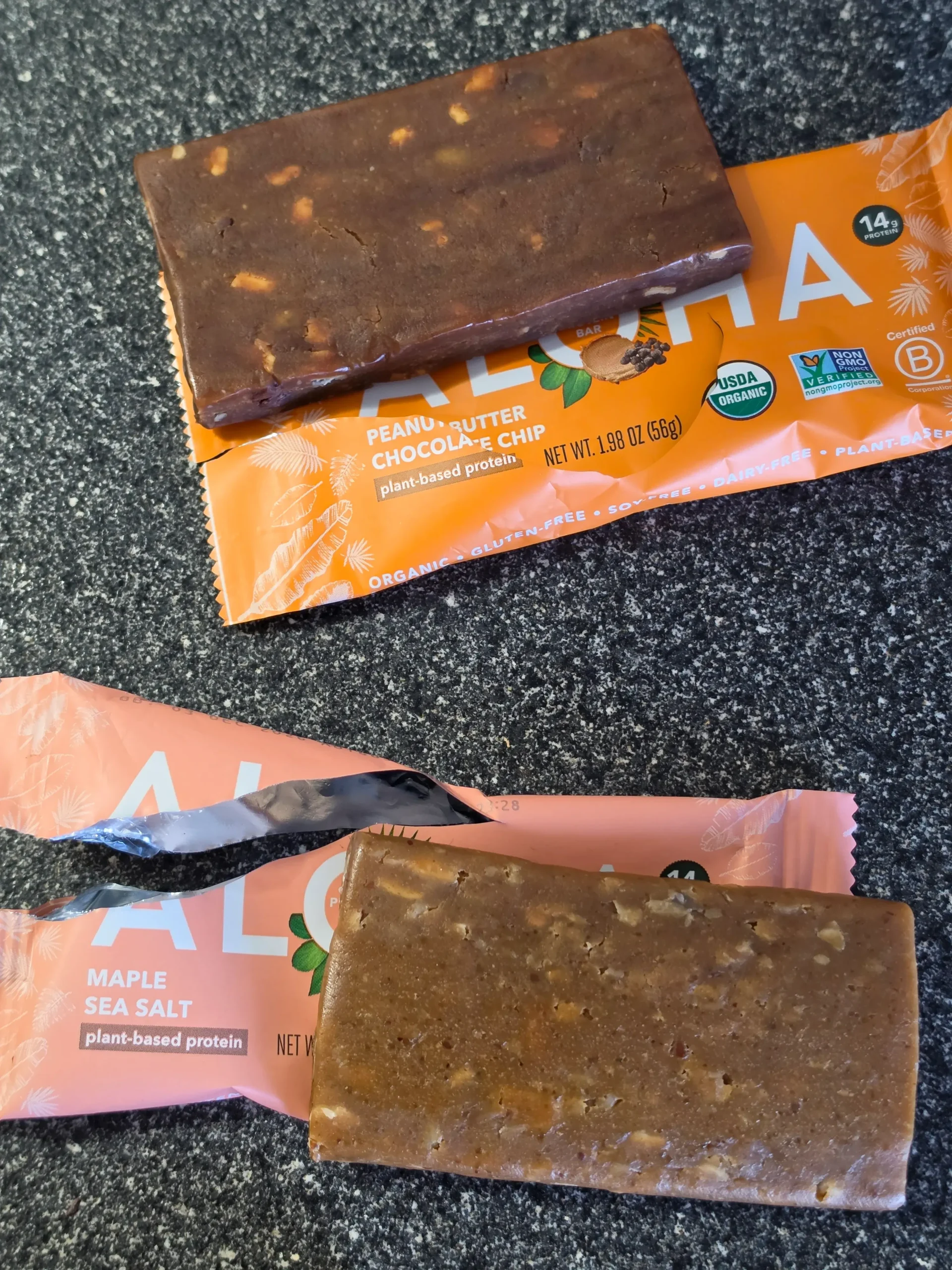 Aloha Plant-Based Protein Bars, Blueberry, Chocolate Cherry, Chocolate Chip Cookie Dough, Chocolate Caramel Pecan, Peanut Butter Chocolate Chip, Maple Sea Salt, and Coconut Chocolate Almond.