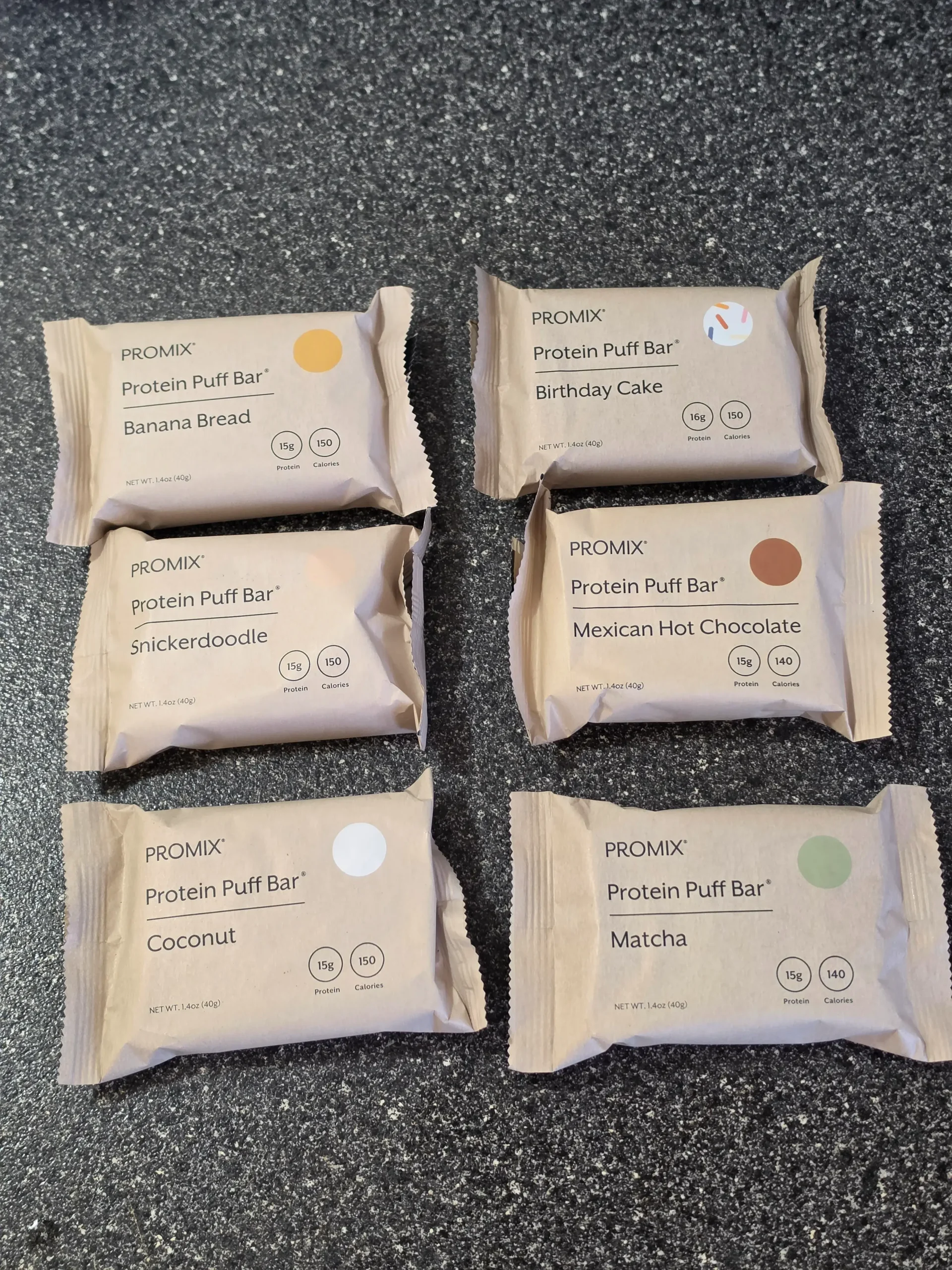 Promix Protein Puff Bar, Coconut, Birthday Cake, Banana Bread, Snickerdoodle, Mexican Hot Chocolate, and Matcha.