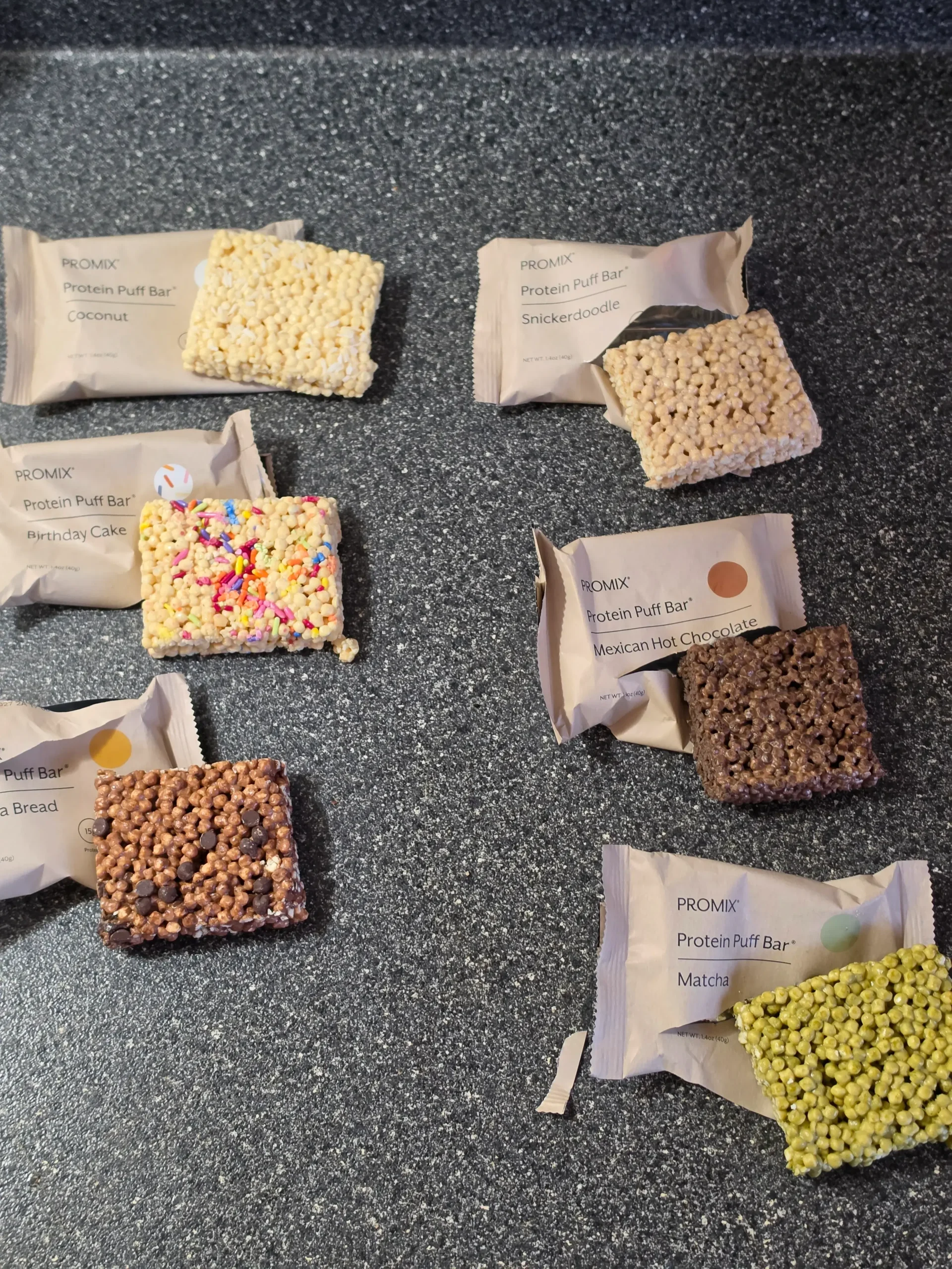 Promix Protein Puff Bar, Coconut, Birthday Cake, Banana Bread, Snickerdoodle, Mexican Hot Chocolate, and Matcha.