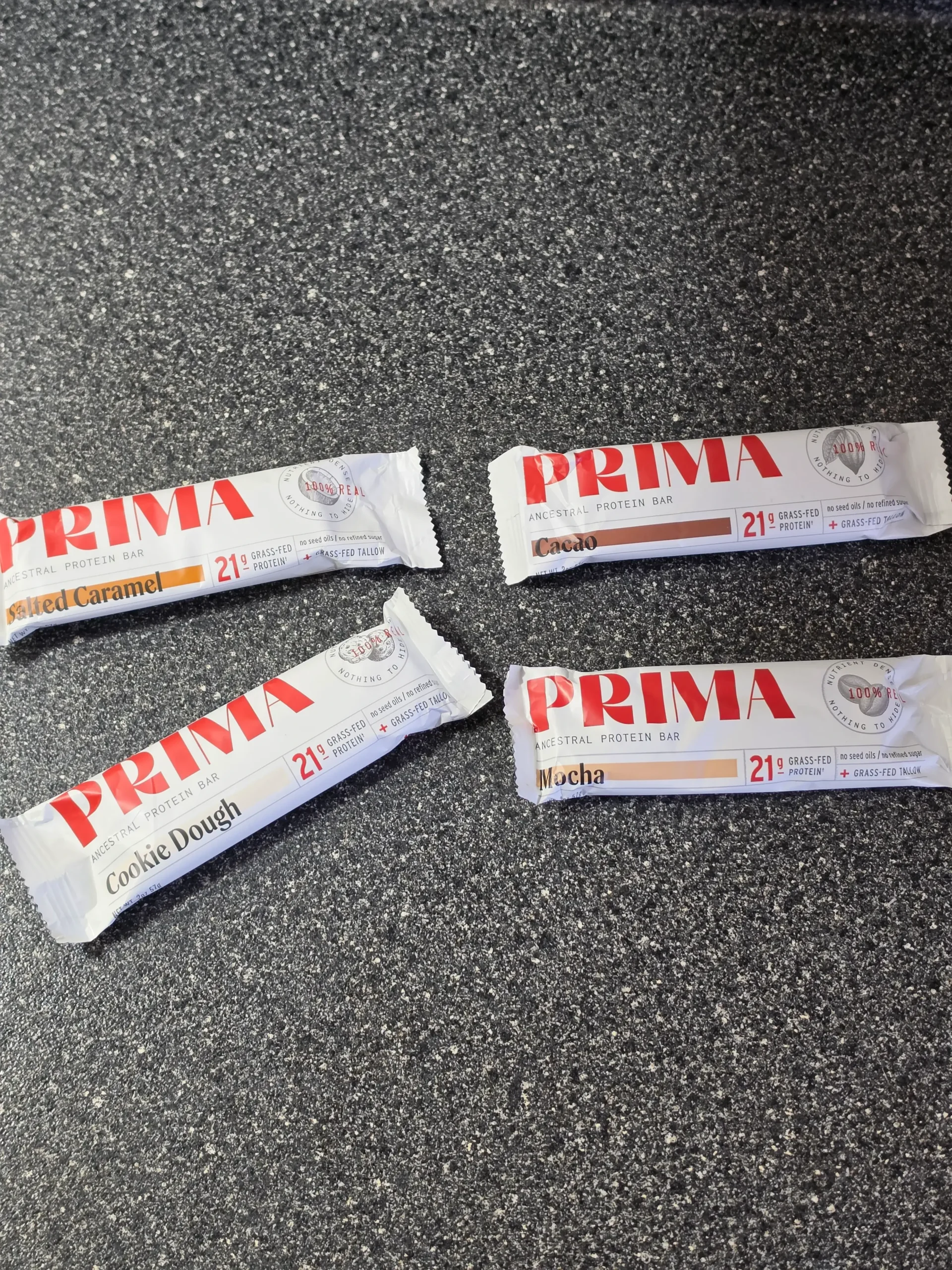 PRIMA Ancestral Protein Bar Variety Pack, Mocha, Cacao, Salted Caramel, and Cookie Dough.