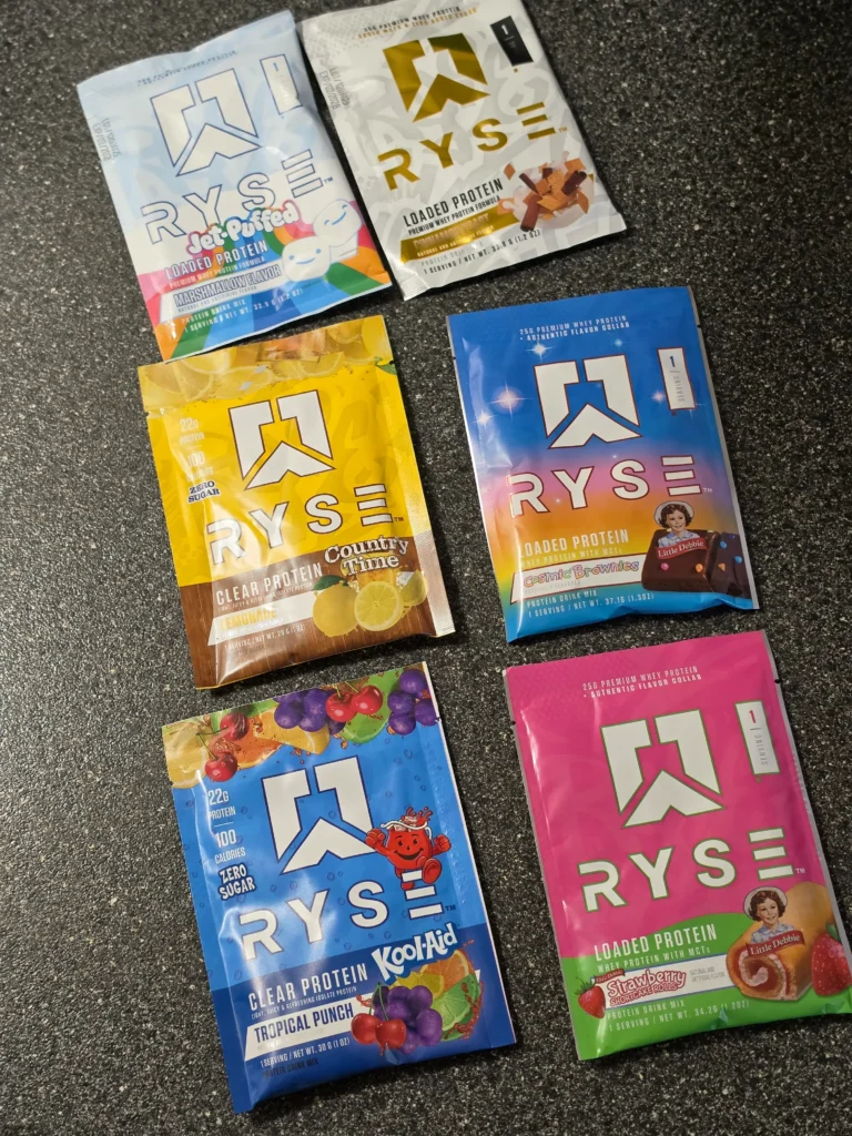 Ryse protein variety pack: Kool-Aid Tropical Punch, Country Time Lemonade, Cinnamon Toast, Little Debbie Cosmic Brownie, Jet-Puffed Marshmallow, Little Debbie Strawberry Shortcake Rolls.